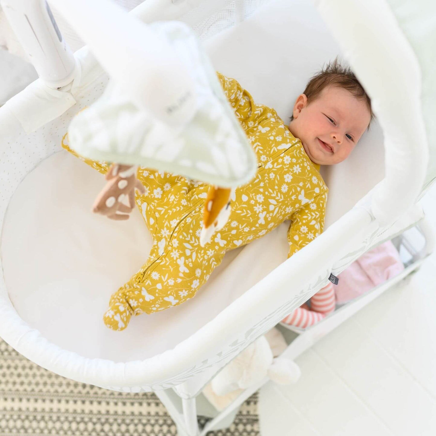 Baby Sleeping in TruBliss Sweetli Calm Bassinet Sage Fern Leaves