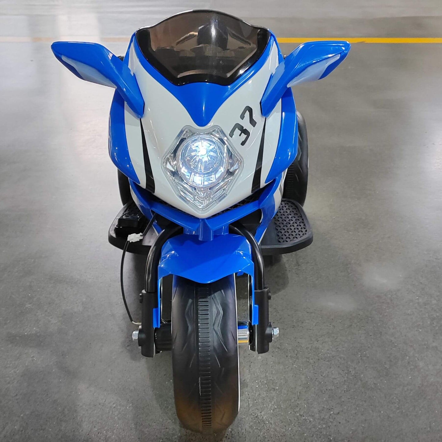 Tamco 6V Kids Electric Motorcycle for 3-4 Years Boys - Blue on a gray floor