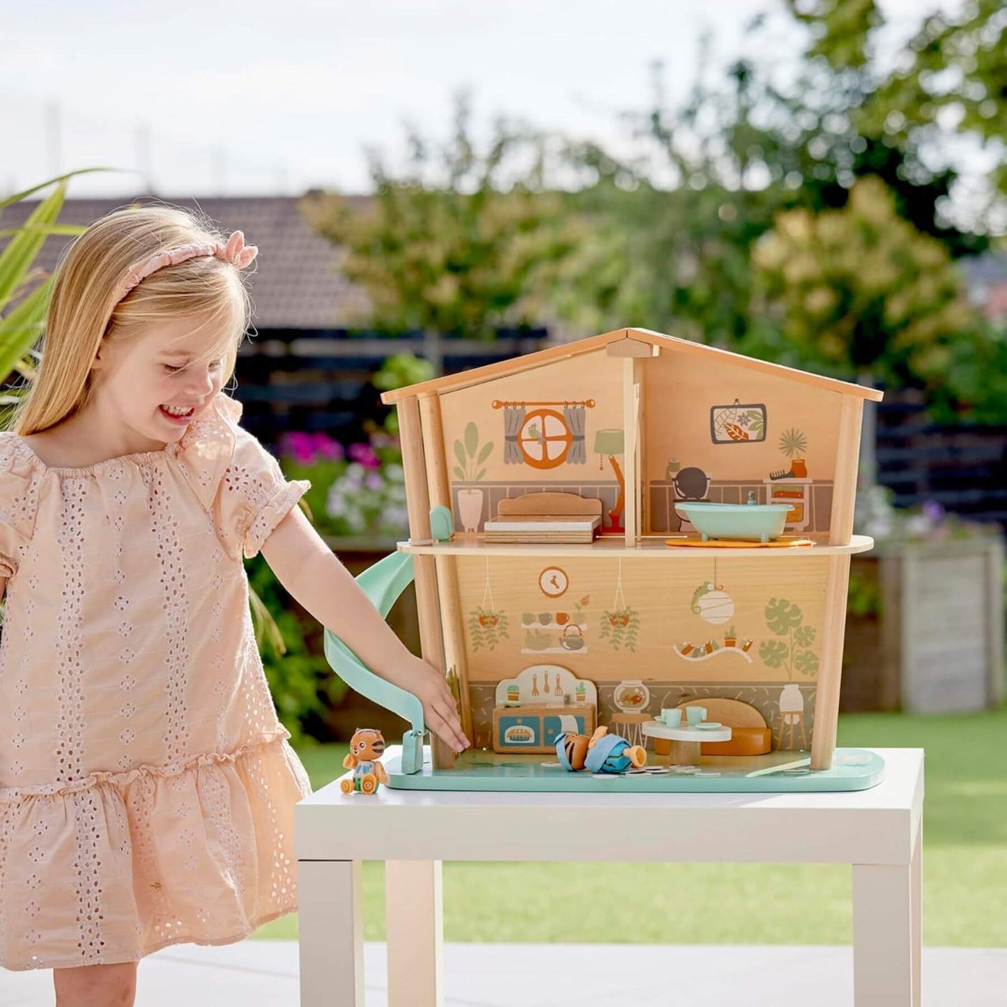 Girl Playing Hape Tigers’ Jungle House