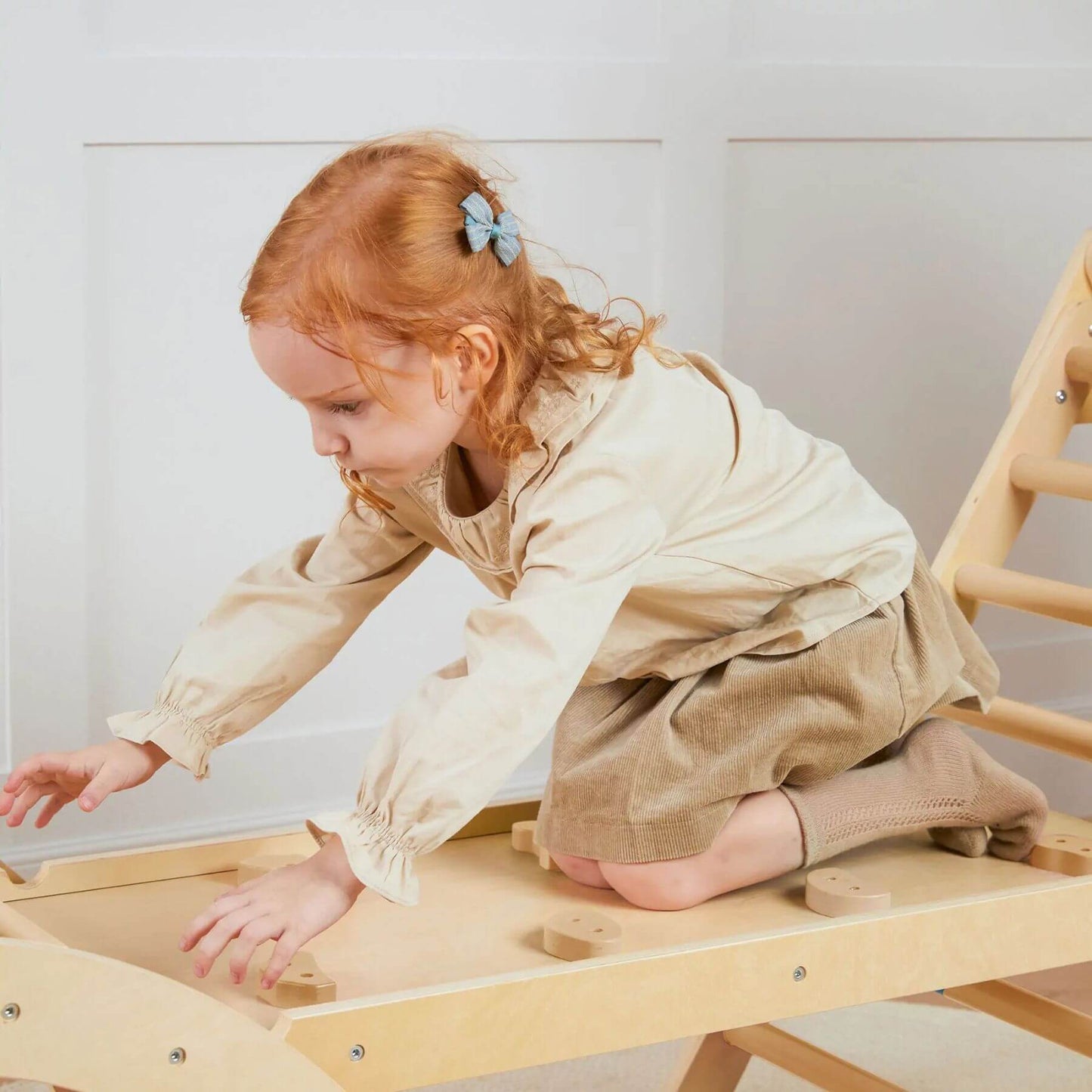 Child Playing Tiny Land® 7-in-1 Montessori Climbing Set with Play Pad