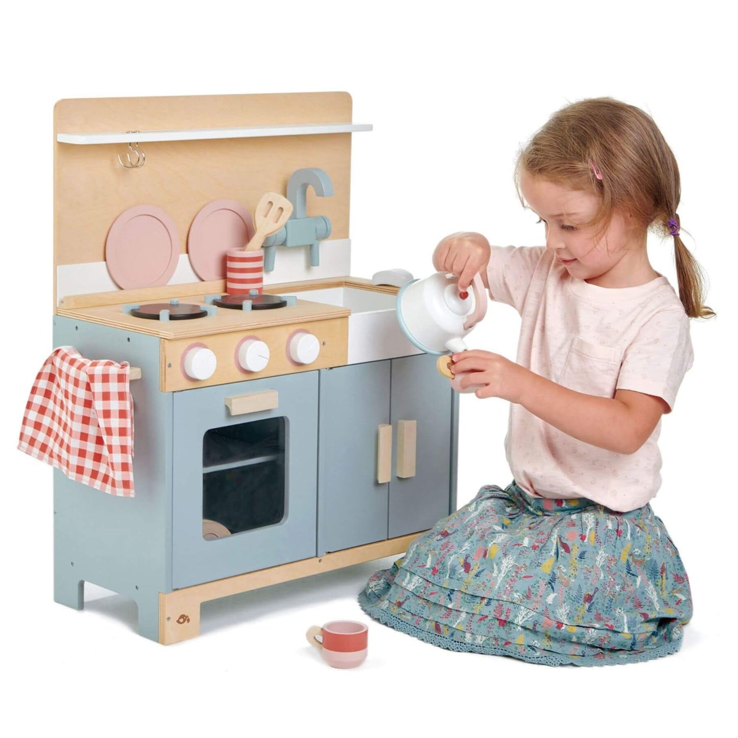 Child playing with Tender Leaf Home Kitchen on a white background