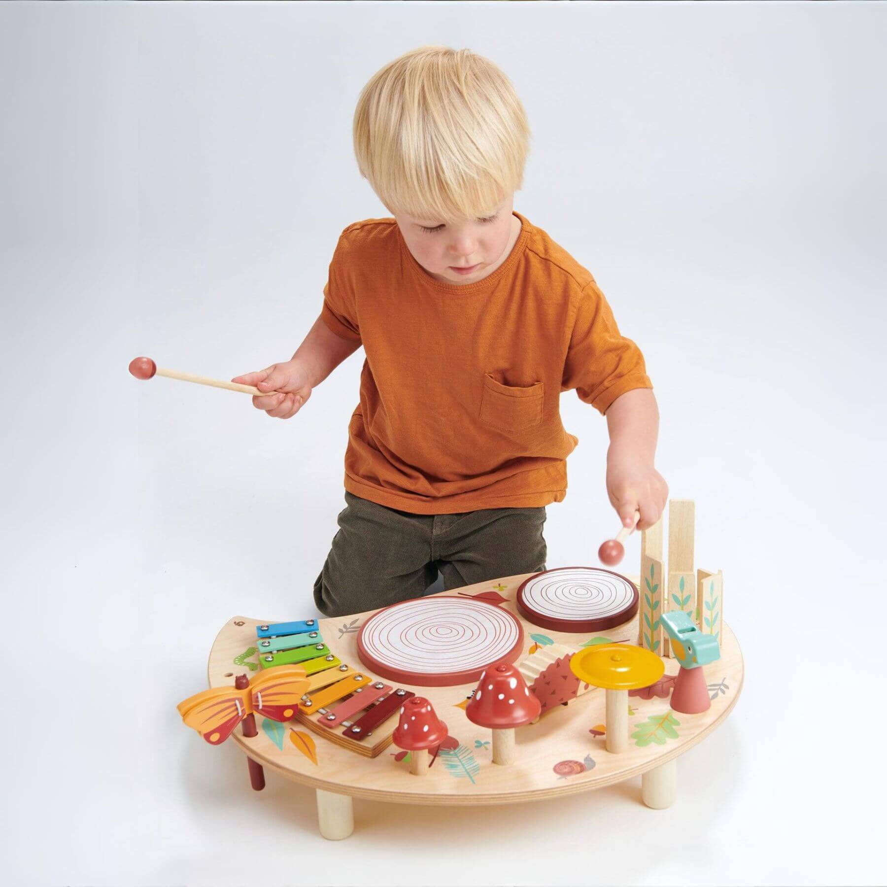 Child playing with Tender Leaf Musical Table