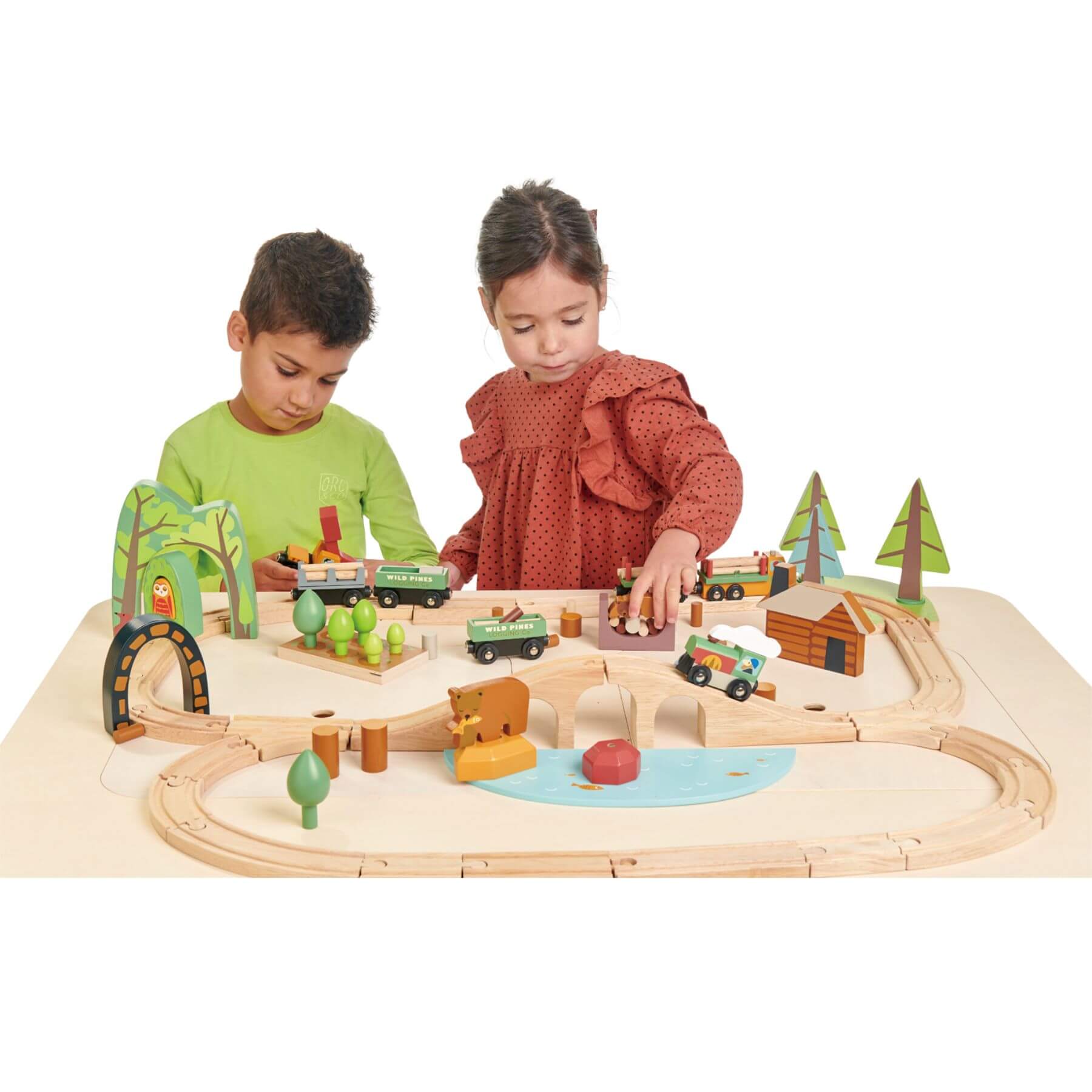 Two children playing with a wooden train set on Tender Leaf Play Table