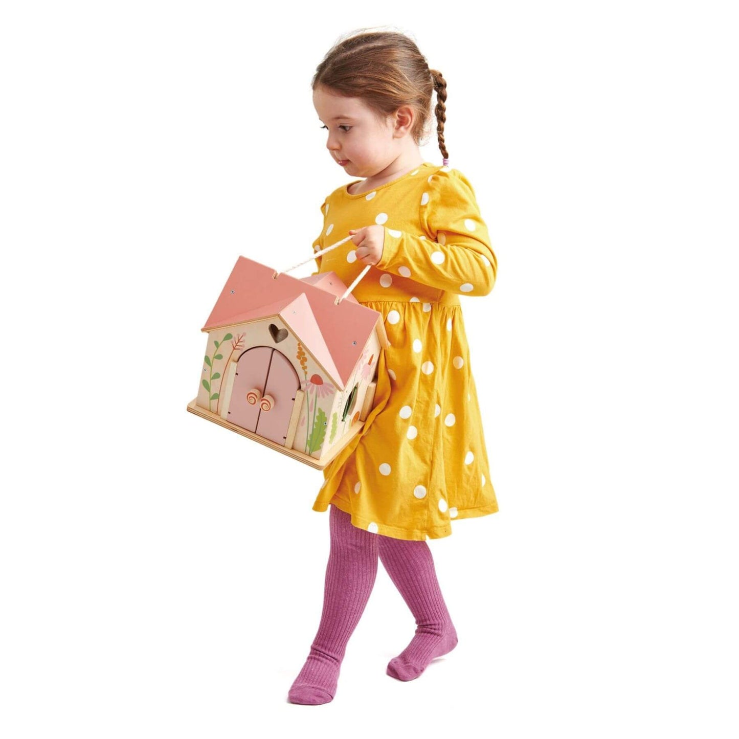 Child in a yellow dress holding Tender Leaf Rosewood Cottage