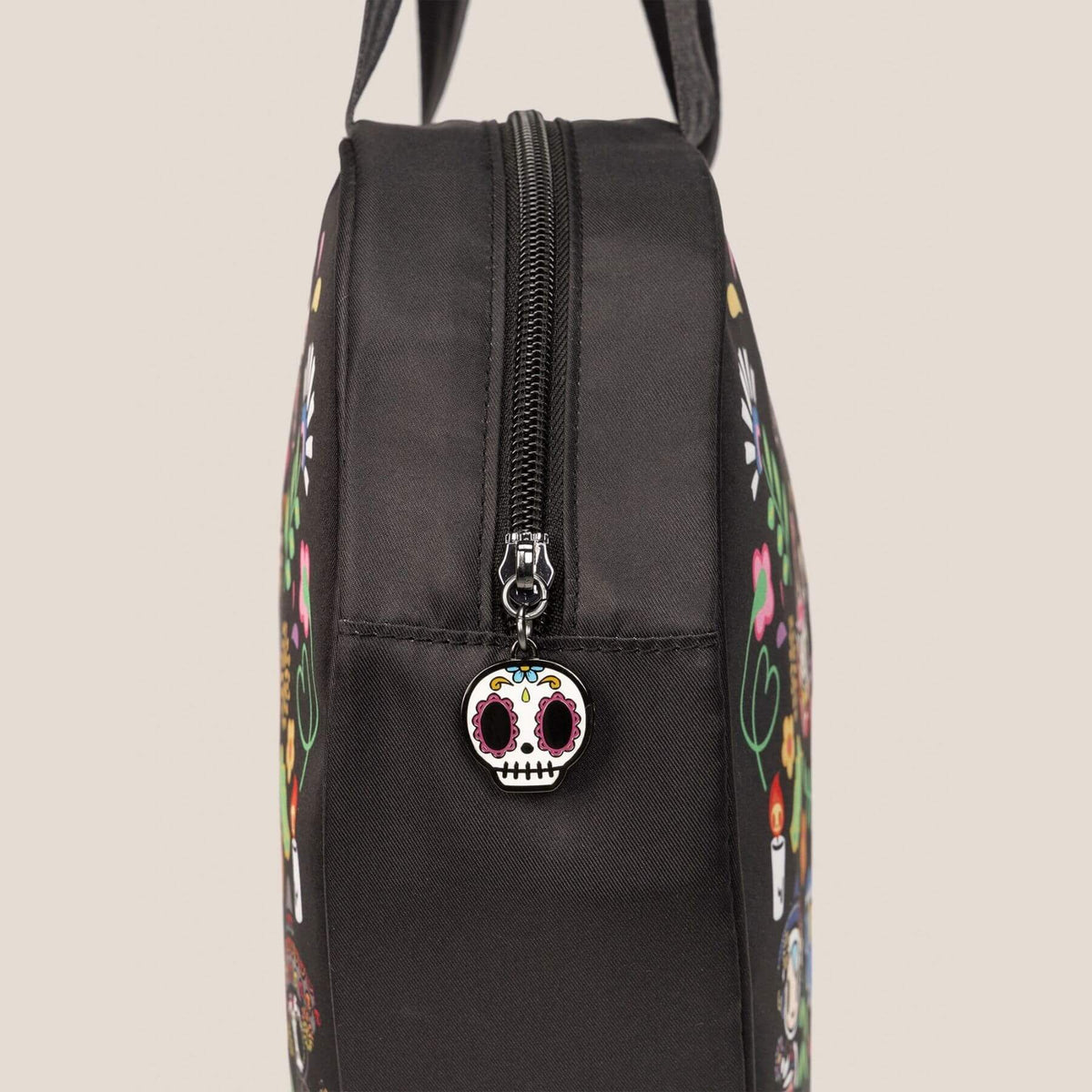 A close-up of tokidoki Heart Tote Diaper Bag – Dia de los Muertos