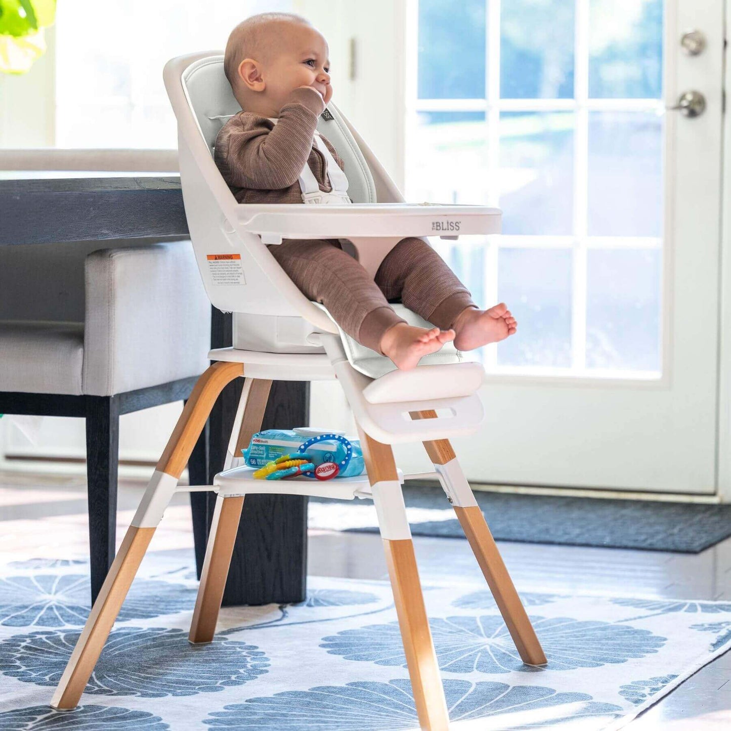 Baby Sitting on TruBliss 2-in-1 Turn-A-Tot Highchair with 360° Swivel Cream