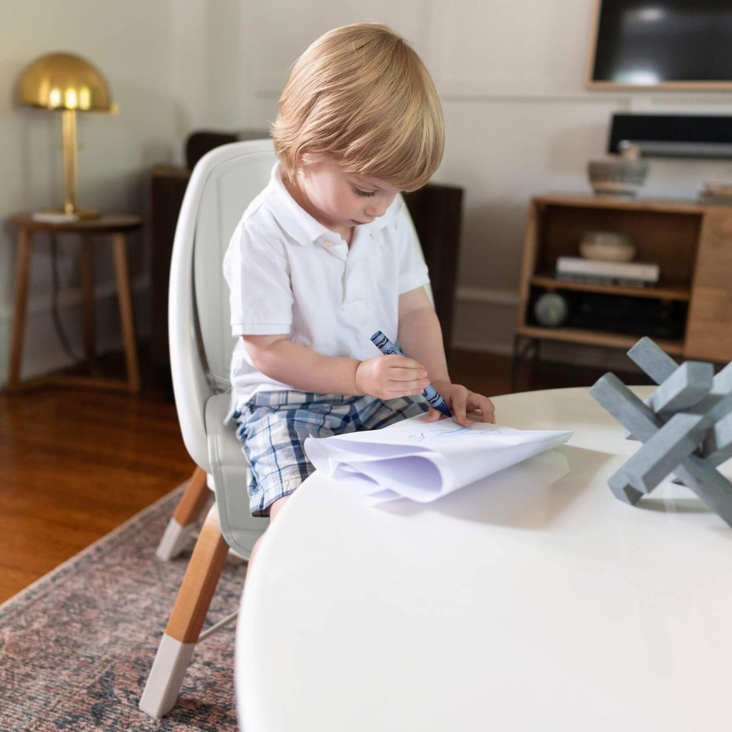 Boy Sitting on TruBliss 2-in-1 Turn-A-Tot Highchair with 360° Swivel Cream