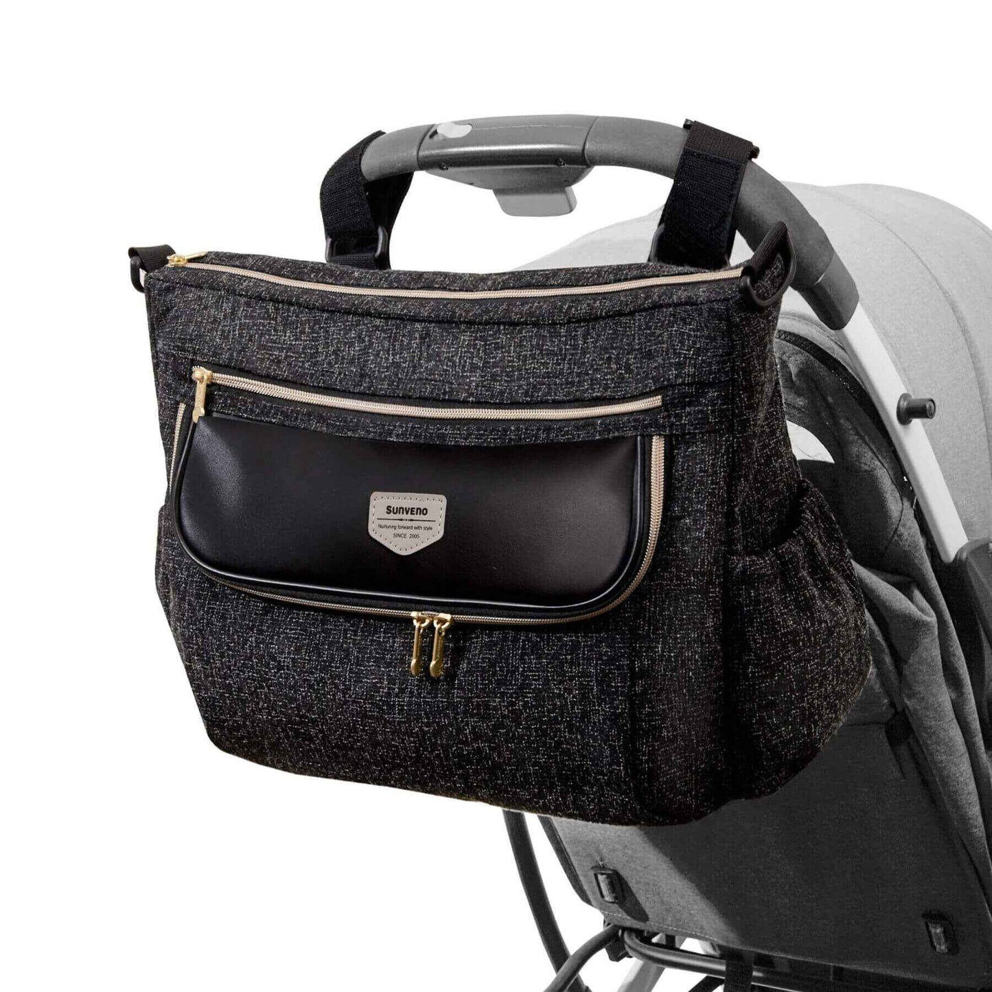 Tweed Luxe Stroller Organizer Black attached to a stroller on a white background