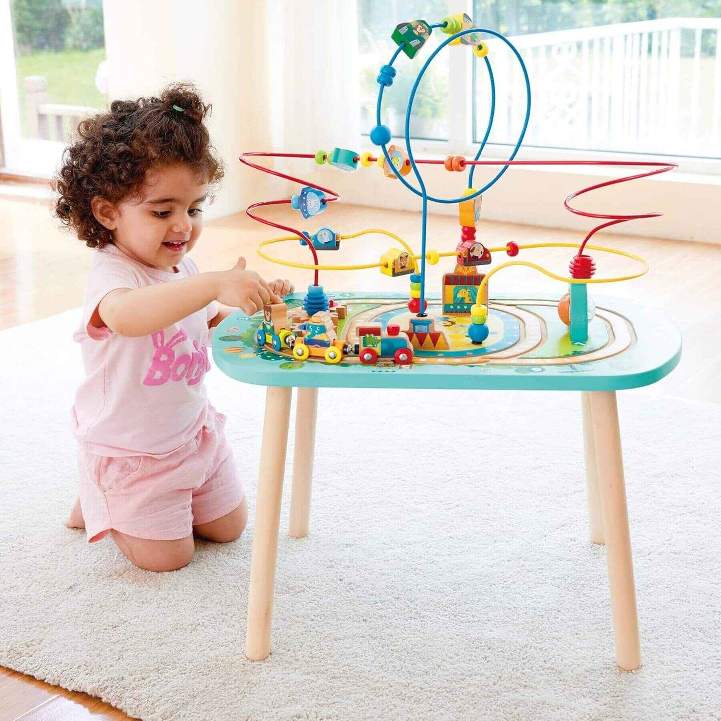 Girl Playing Hape Twisting Railway Maze Table