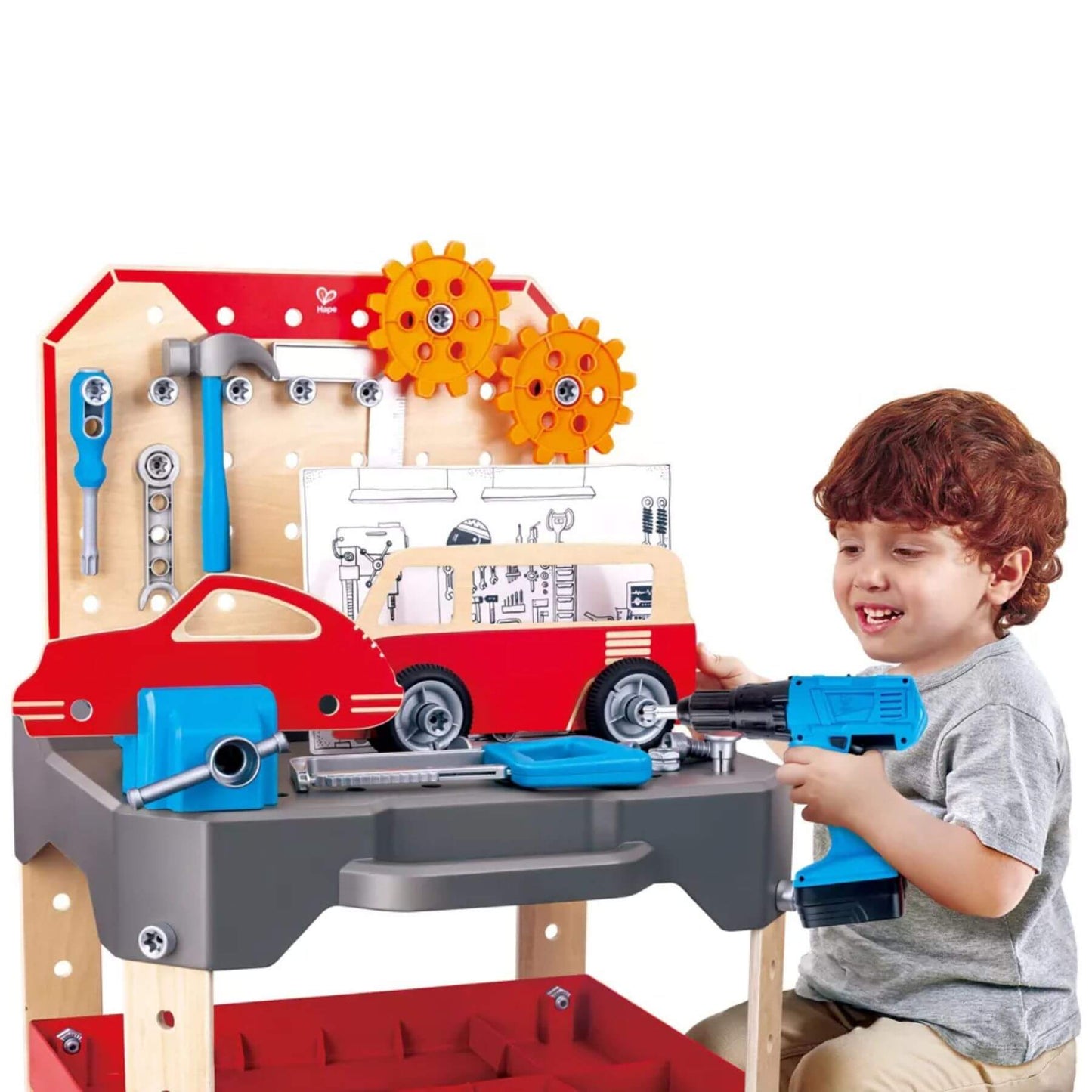 Child playing with Hape Vehicle Service & Repair Workbench