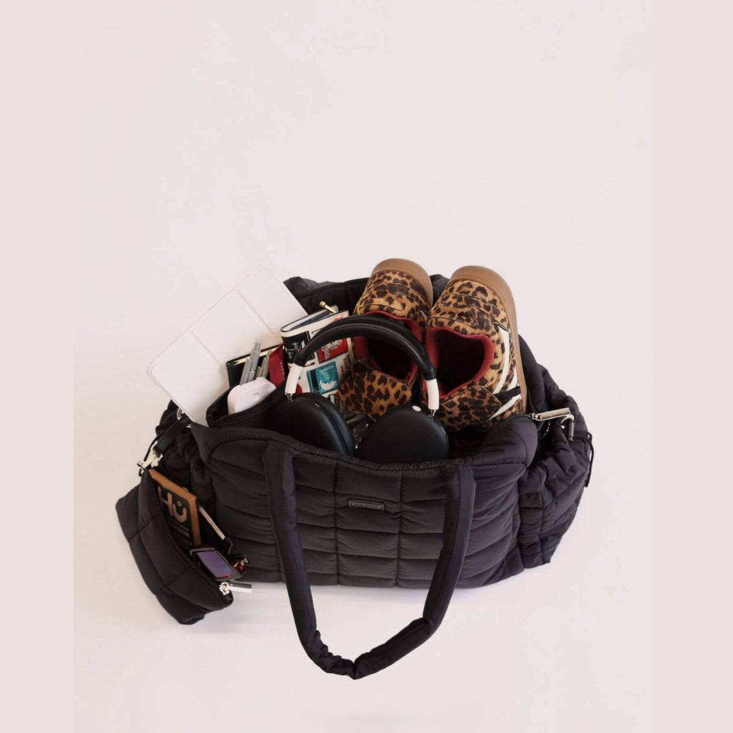 augustnoa the weekender duffle bag black with leopard print shoes and other items