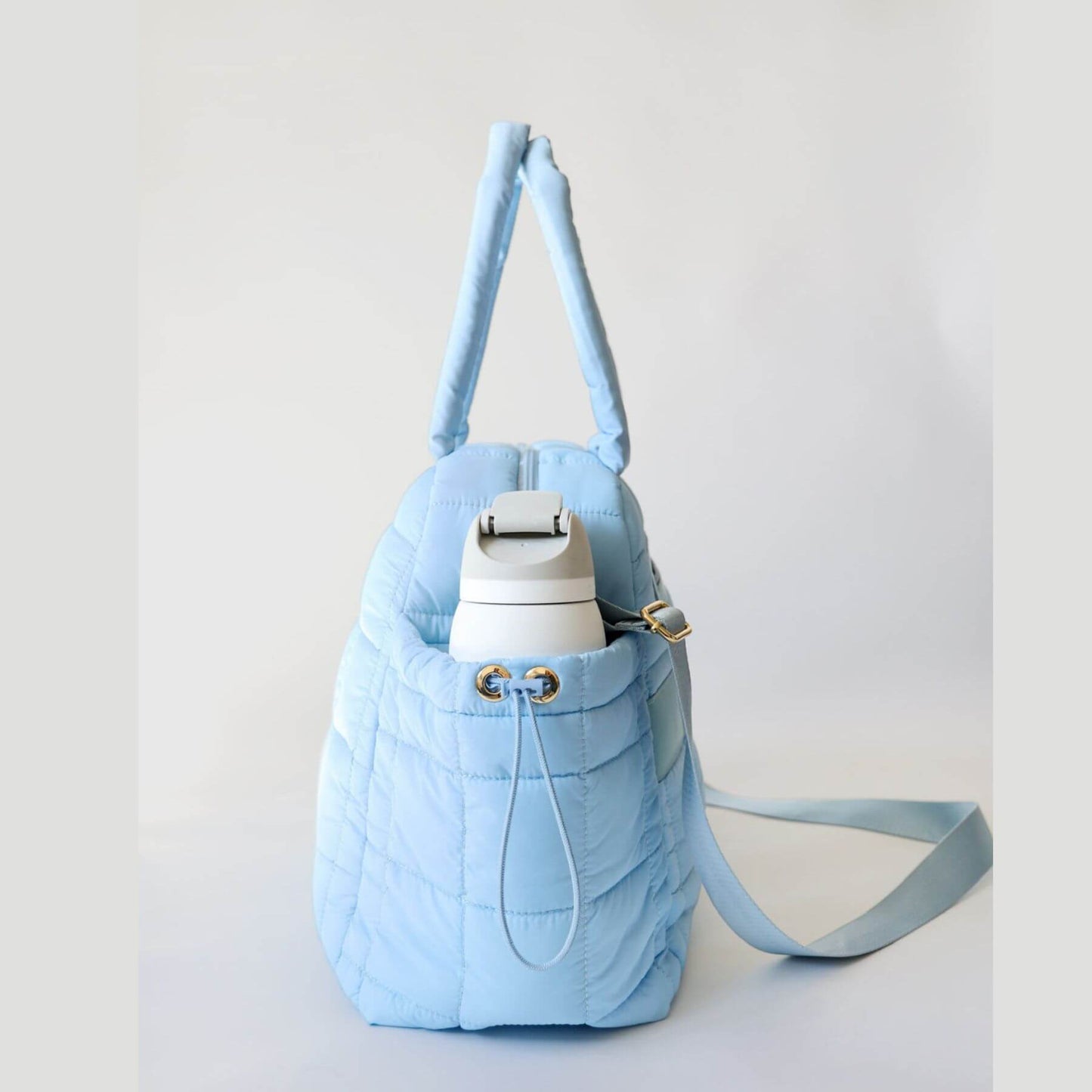 Side View of augustnoa the weekender duffle bag blue