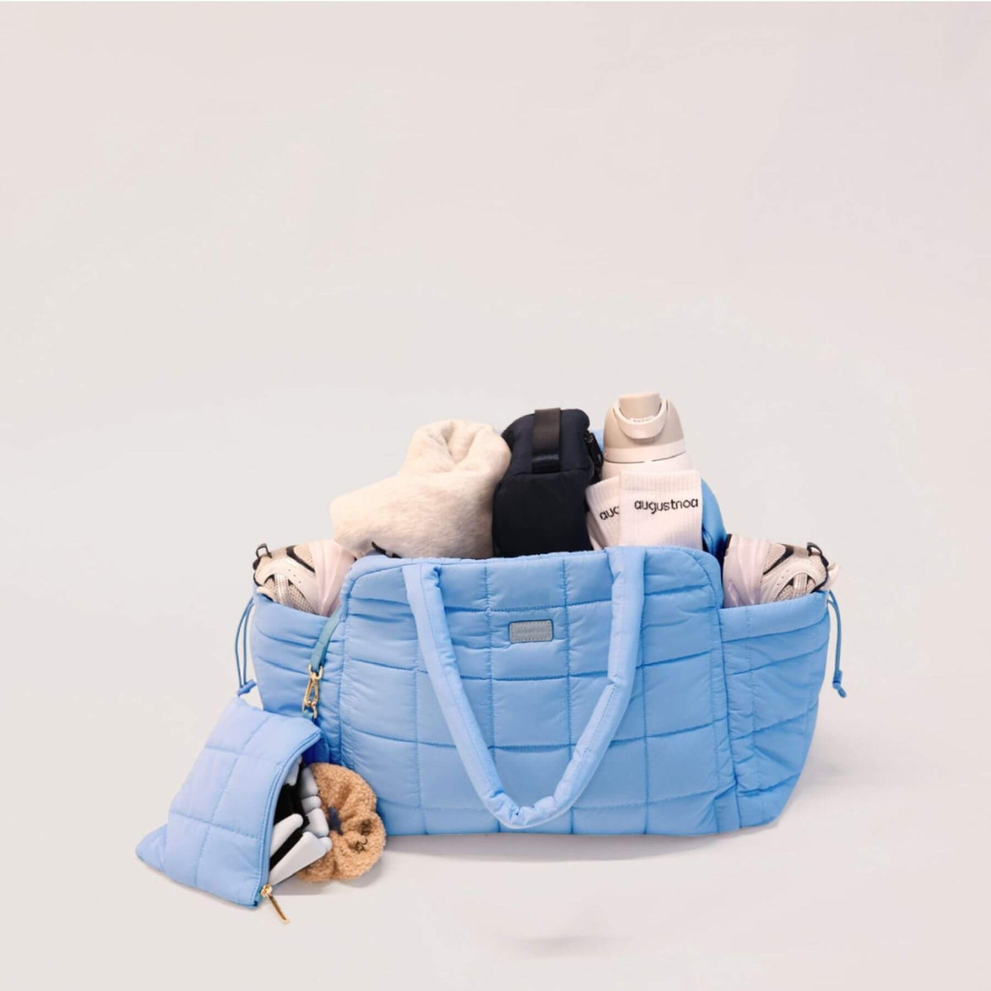 augustnoa the weekender duffle bag blue with baby items