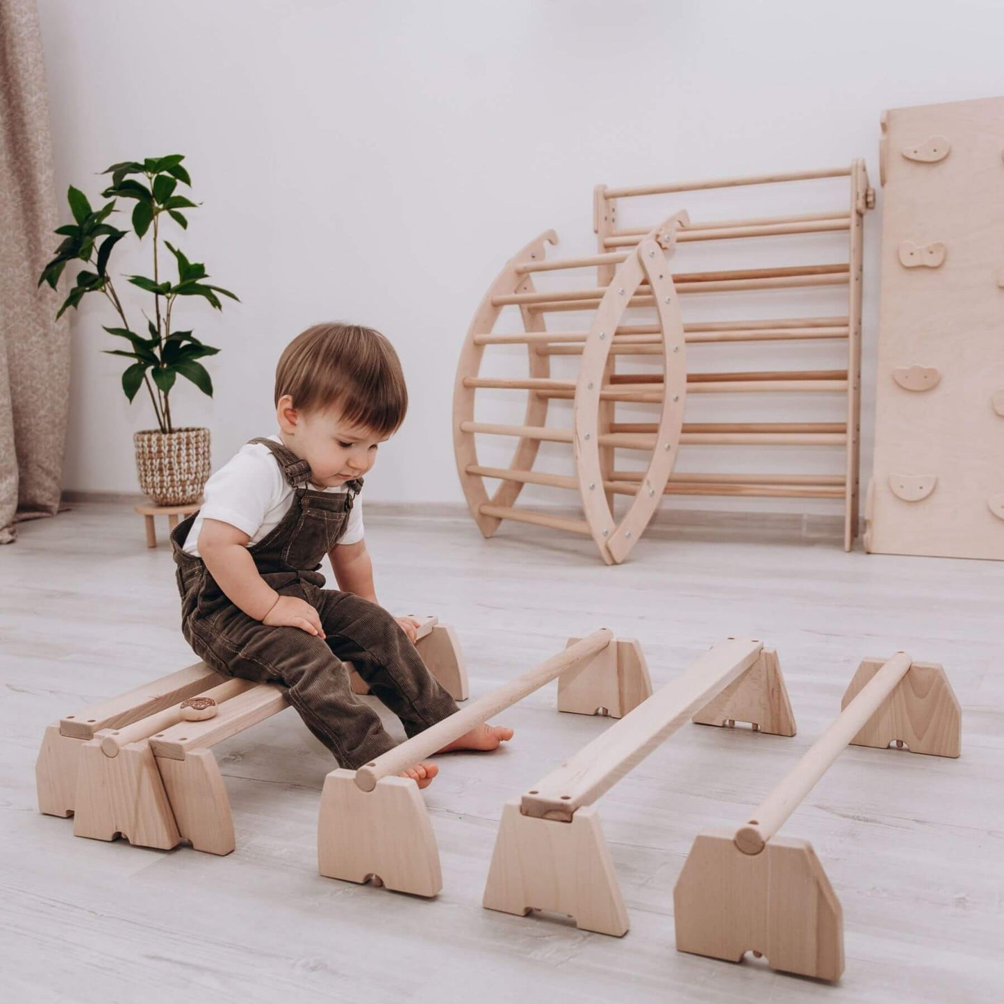 Boy Playing Wood and Hearts Balance Beam Set