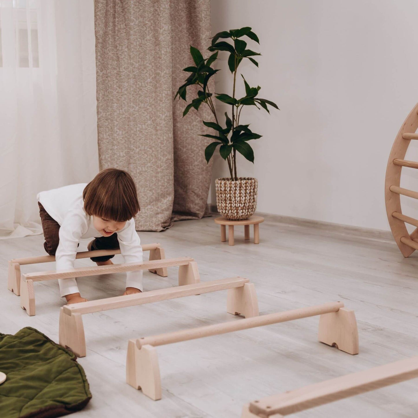 Boy Playing Wood and Hearts Balance Beam Set