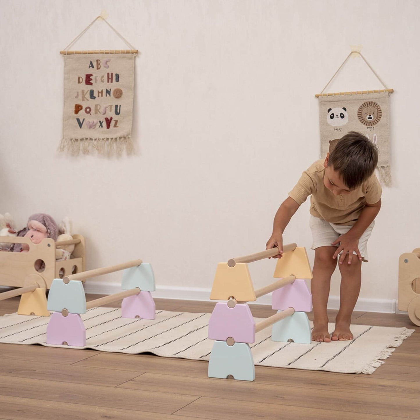 Boy Playing Wood and Hearts Balance Beam Set