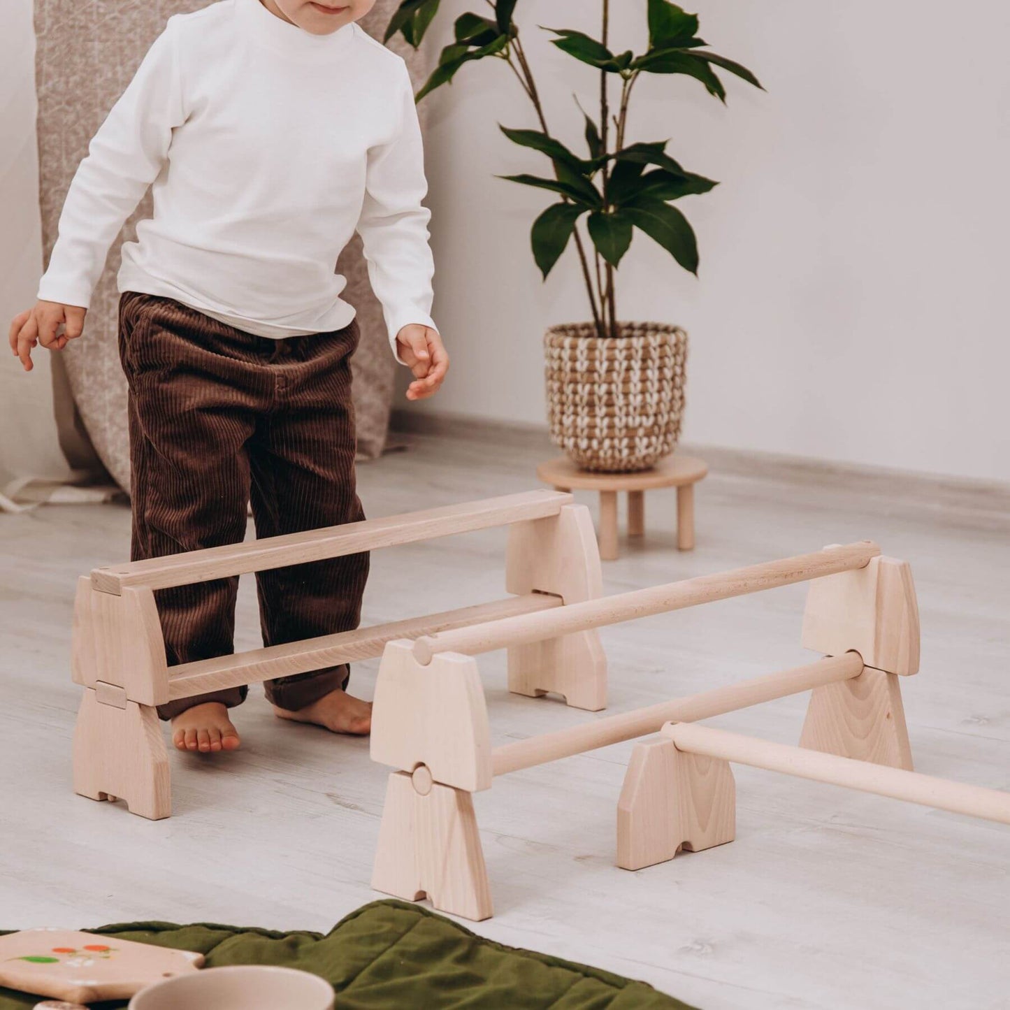 Boy Playing Wood and Hearts Balance Beam Set