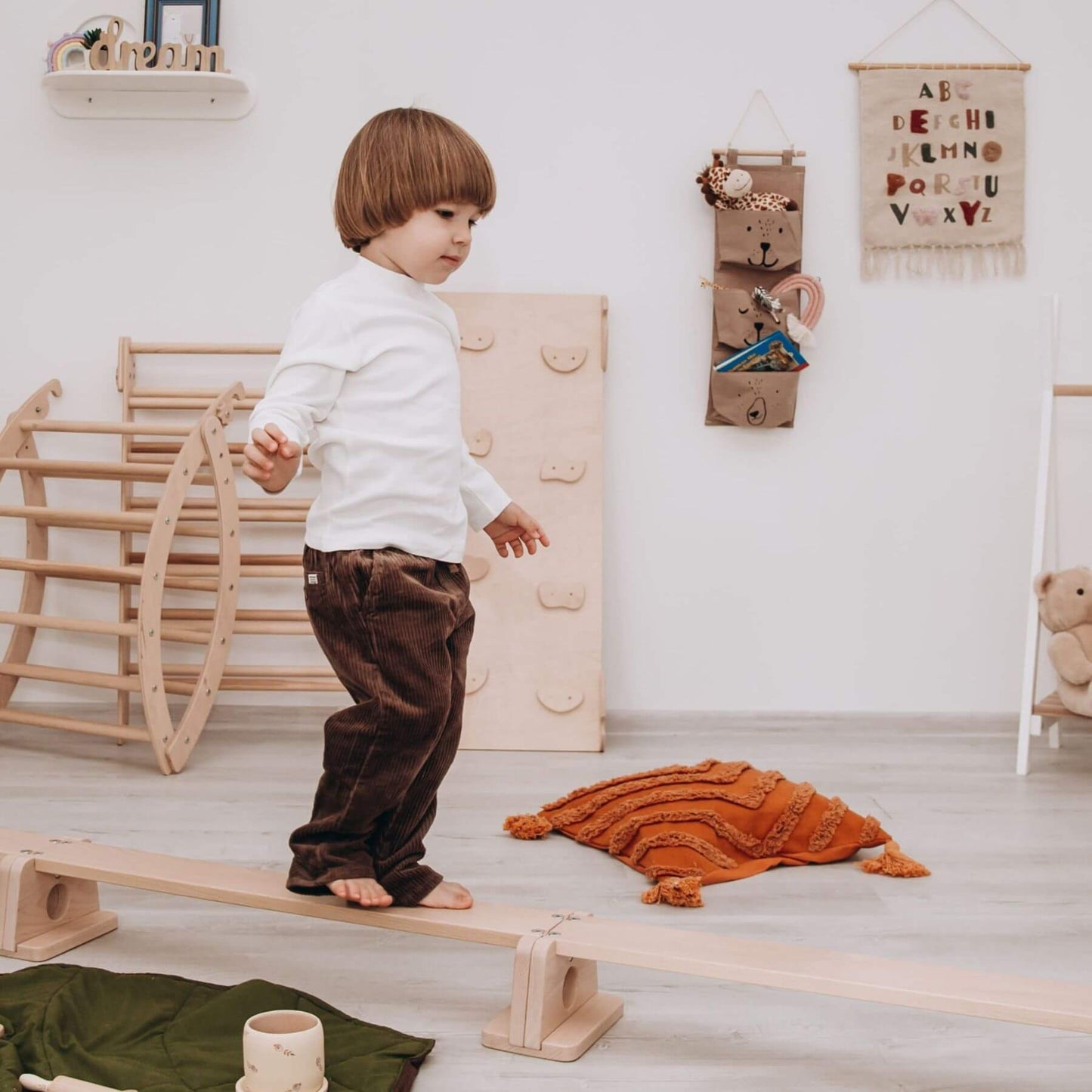Boy Walking on Wood and Hearts Balance Beam Straight