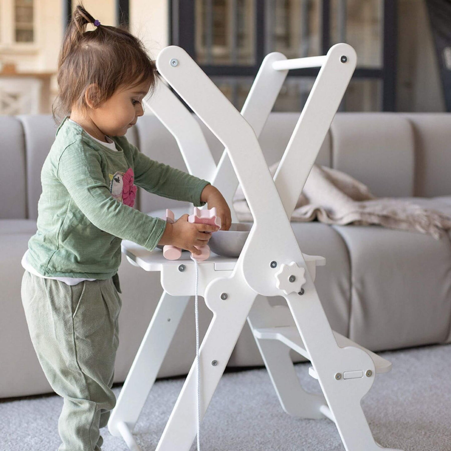 Girl Playing at Wood and Hearts Foldable Kitchen Tower