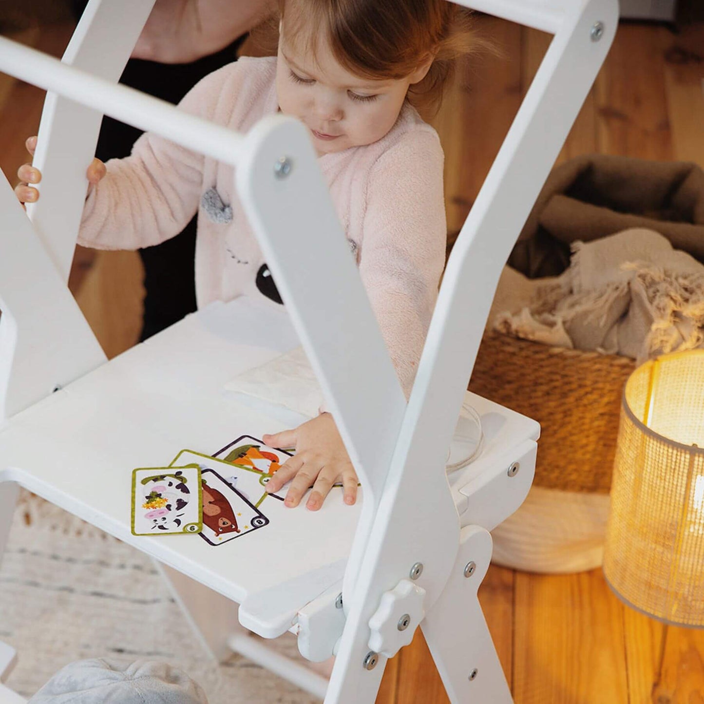 Girl Playing Cards at Wood and Hearts Foldable Kitchen Tower in White