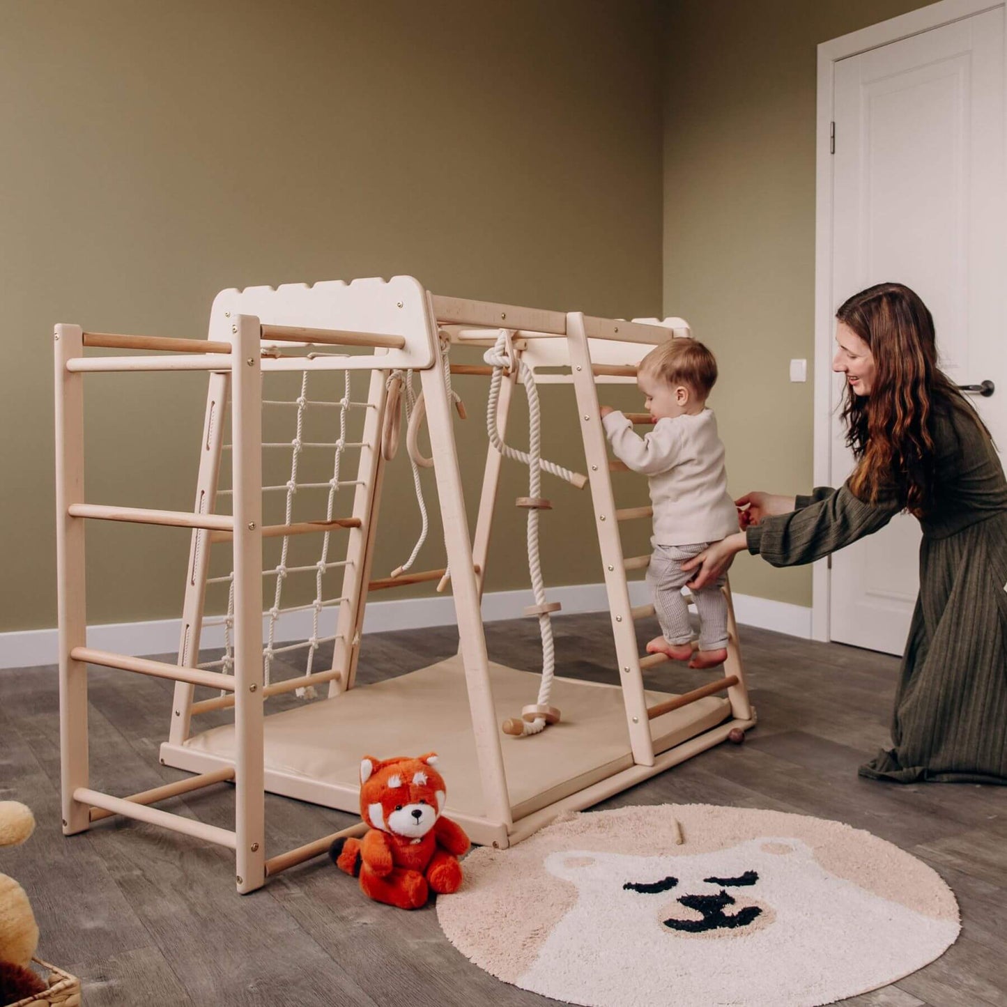 Mom Holding Baby Climbing on Wood and Hearts Indoor Jungle Gym - Trapeze + Ladder + Mat + Rope