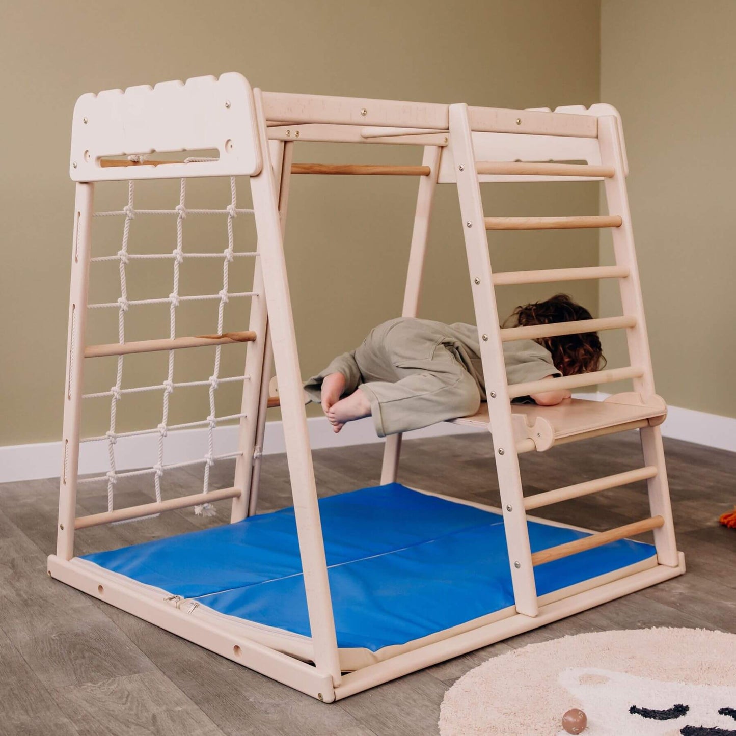 Kid Climbing on Wood and Hearts Indoor Jungle Gym