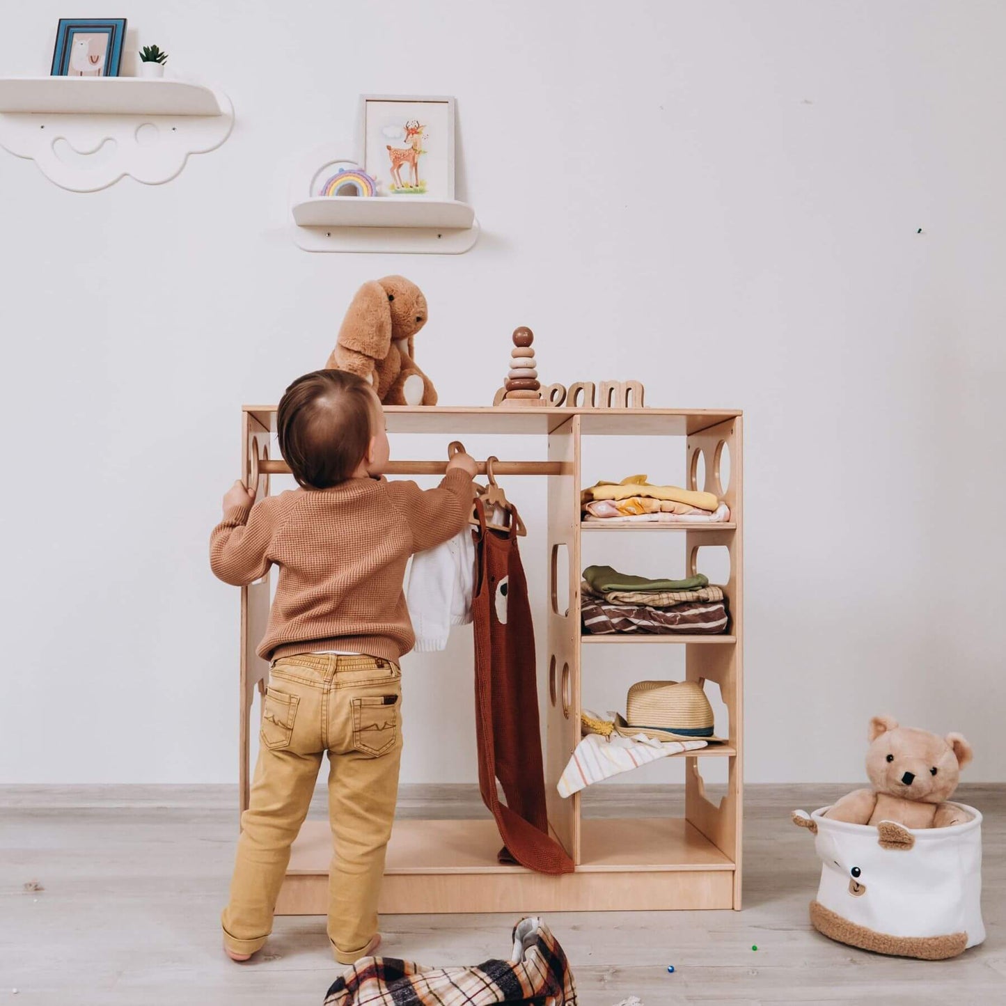 Boy Hanging Cloth on Wood and Hearts Montessori Closet