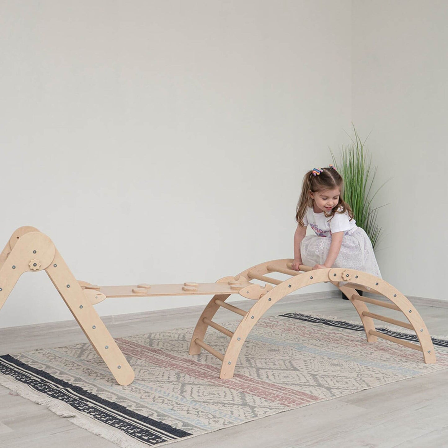 Girl Climbing on Wood and Hearts Triangle Climber Set Natural