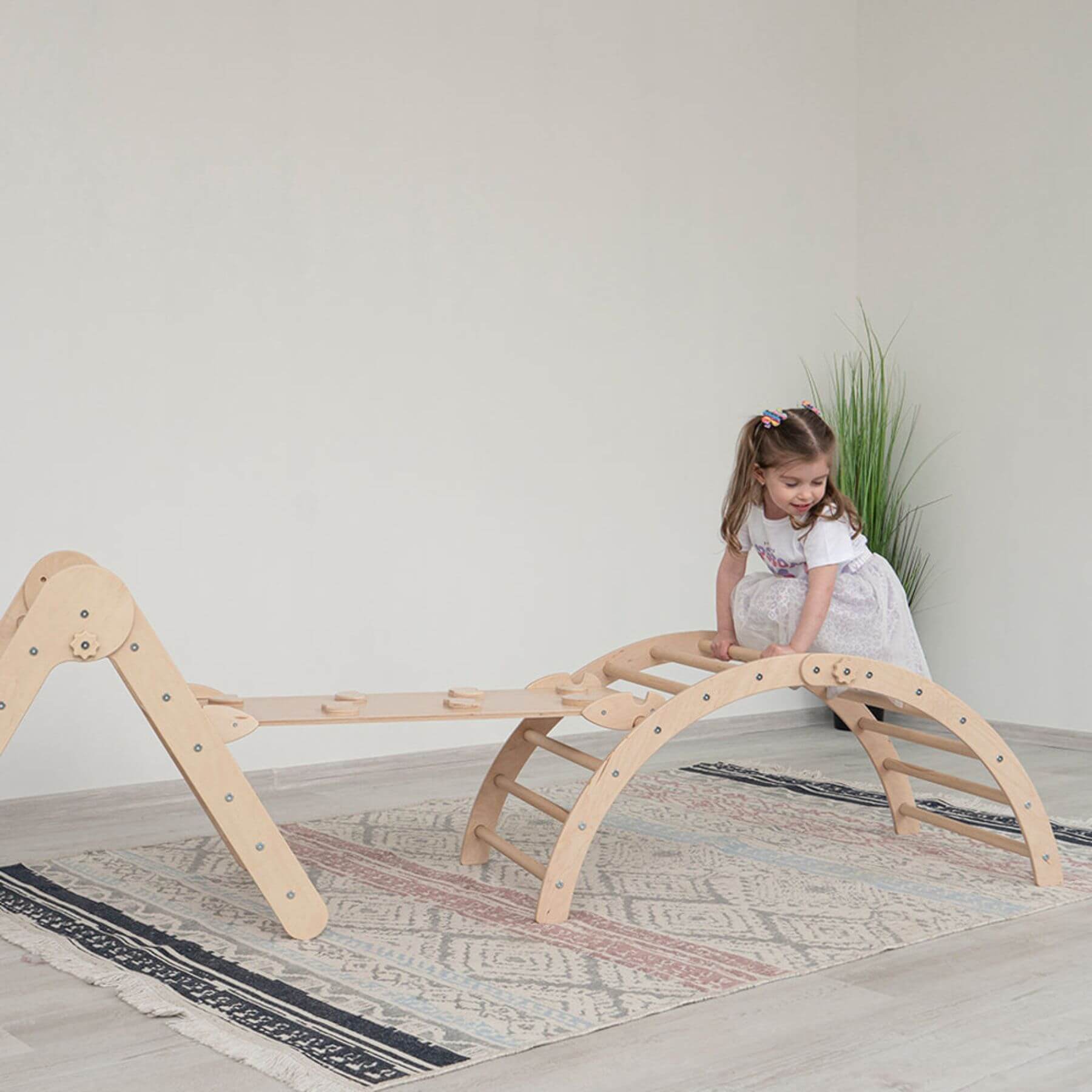 Girl Climbing on Wood and Hearts Triangle Climber Set Natural