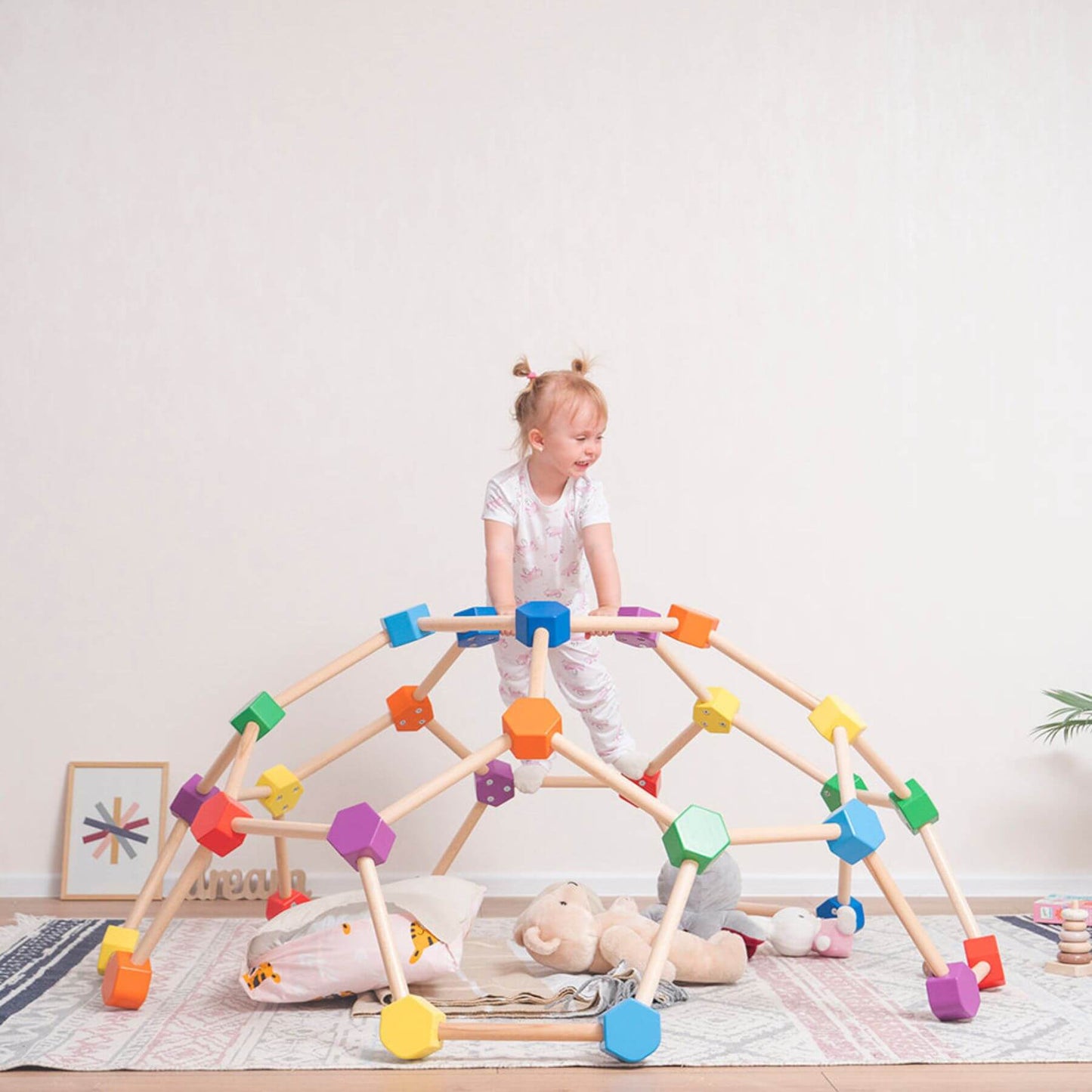 Girl Playing Wood and Hearts Wooden Climbing Dome