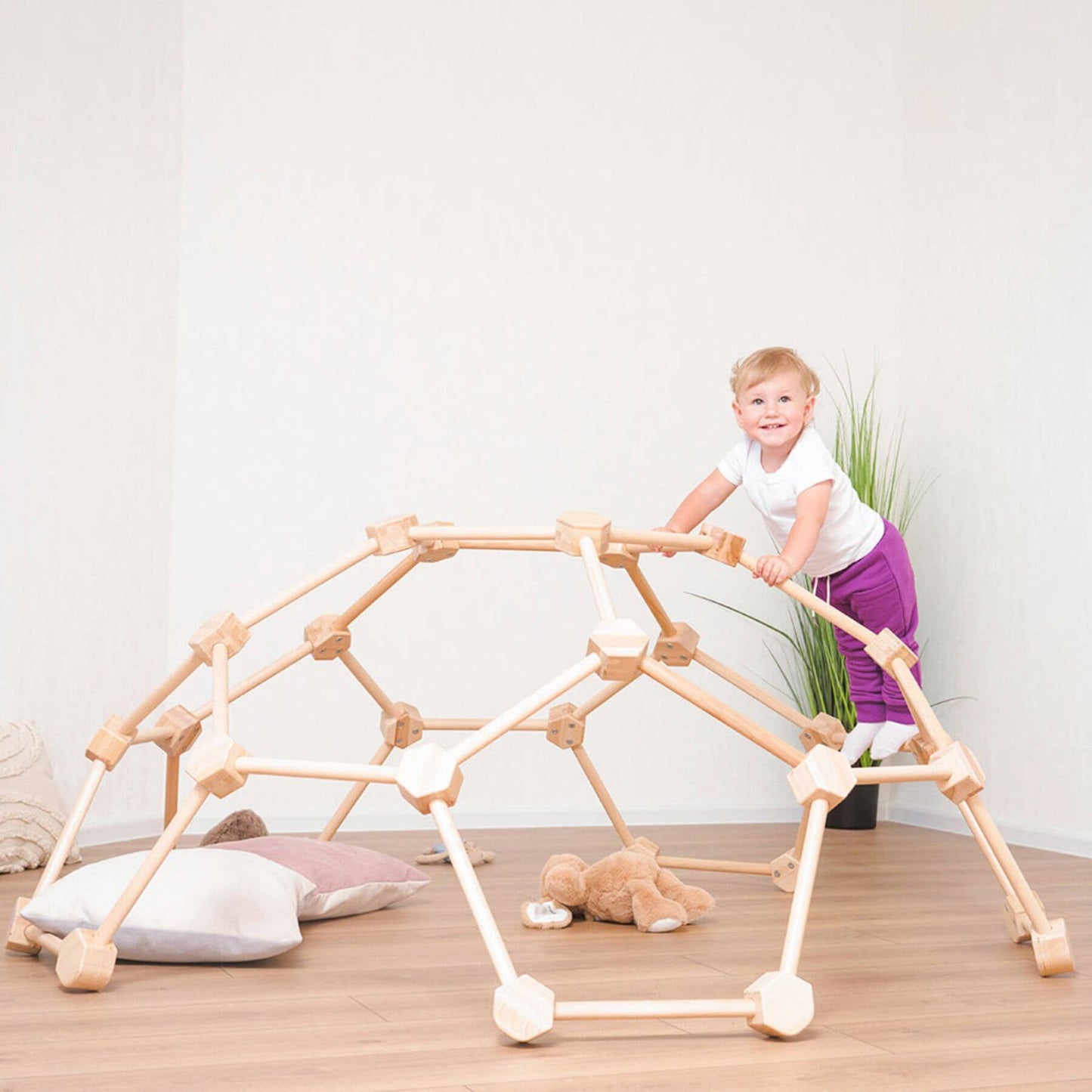 Girl Playing Wood and Hearts Wooden Climbing Dome
