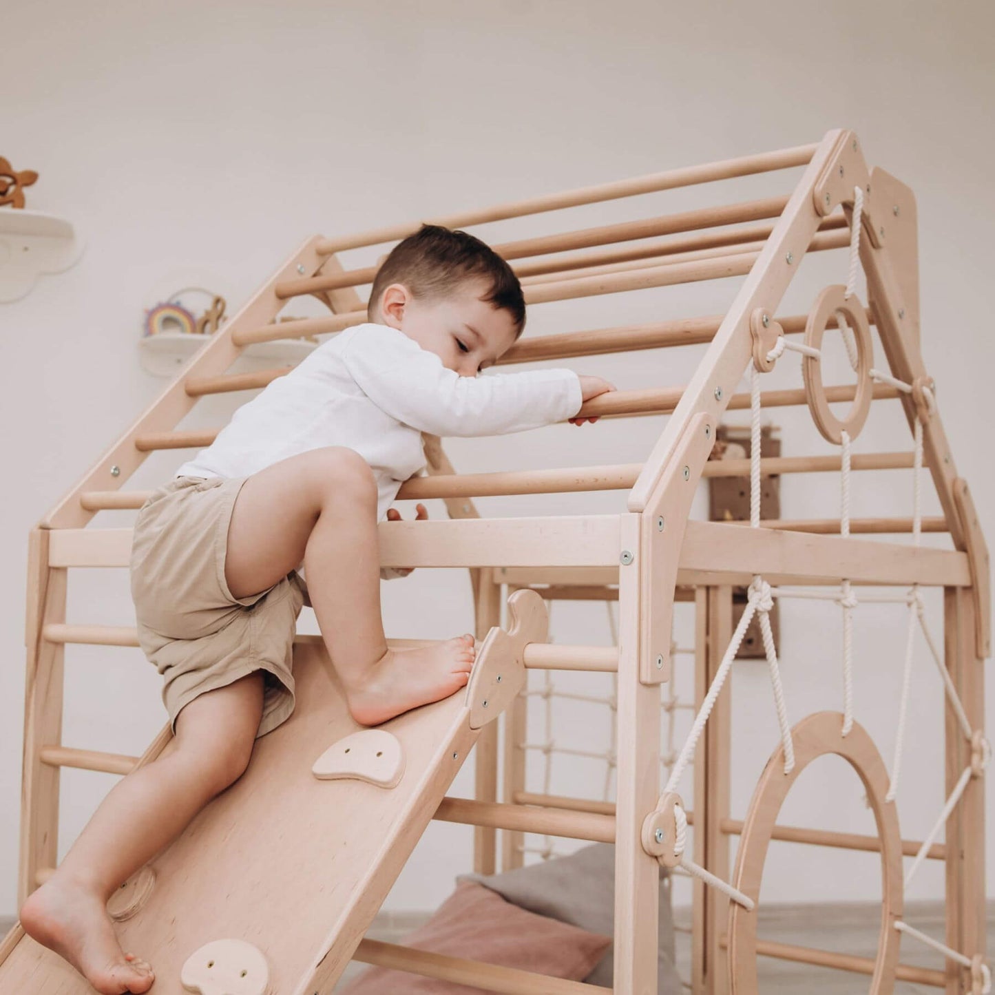 Boy Climbing on Wood and Hearts Wooden Climbing Playhouse w/ Ramp Natural
