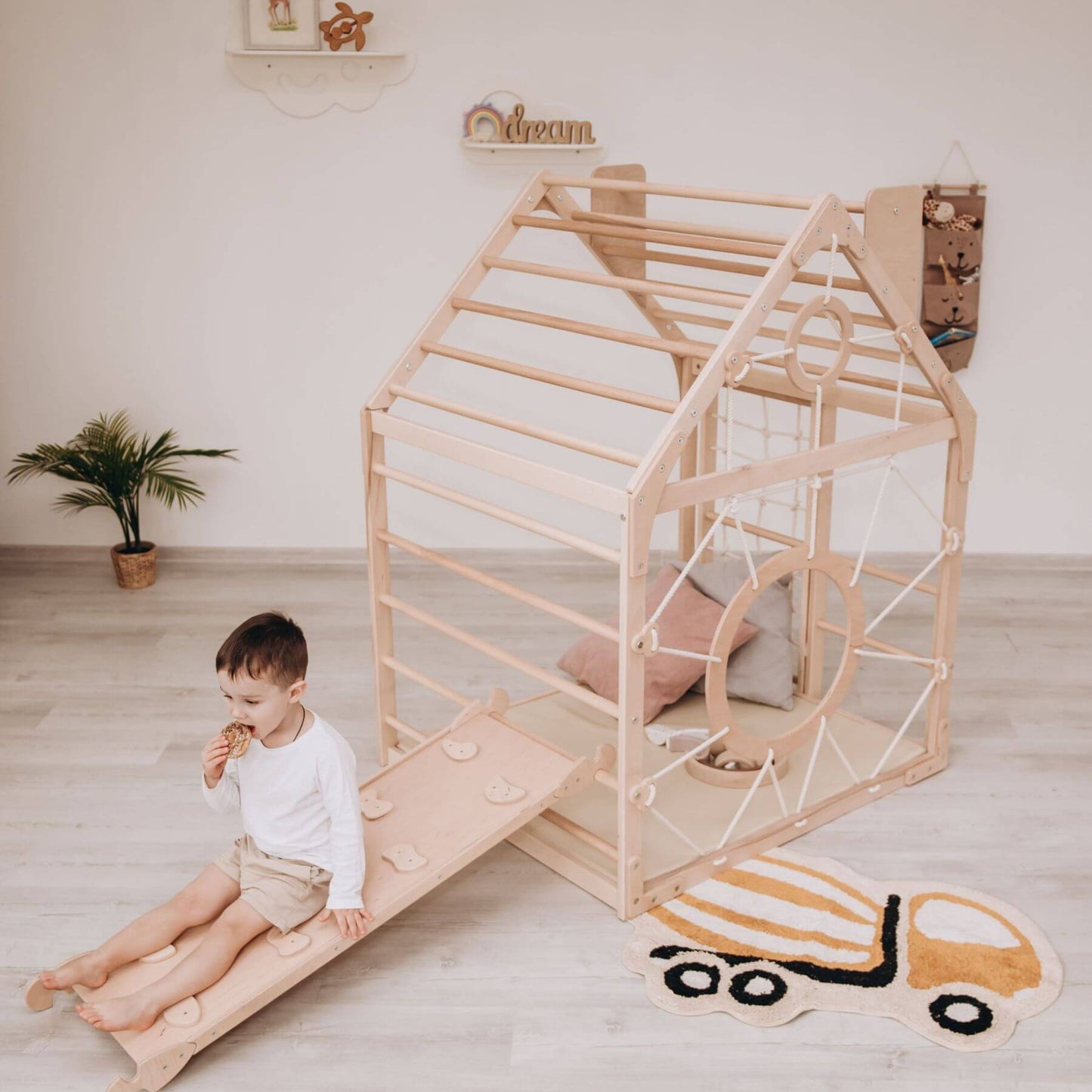 Boy Playing on Wood and Hearts Wooden Climbing Playhouse w/ Ramp Natural