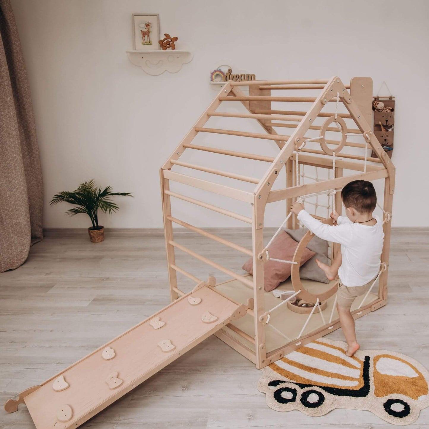 Boy Climbing on Wood and Hearts Wooden Climbing Playhouse w/ Ramp Natural