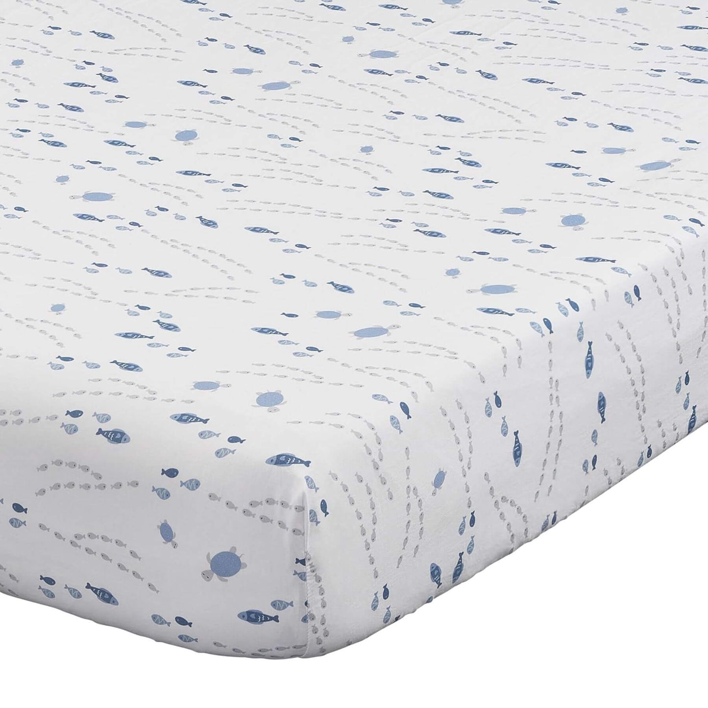 Quilted baby blanket with blue fish pattern on a white background