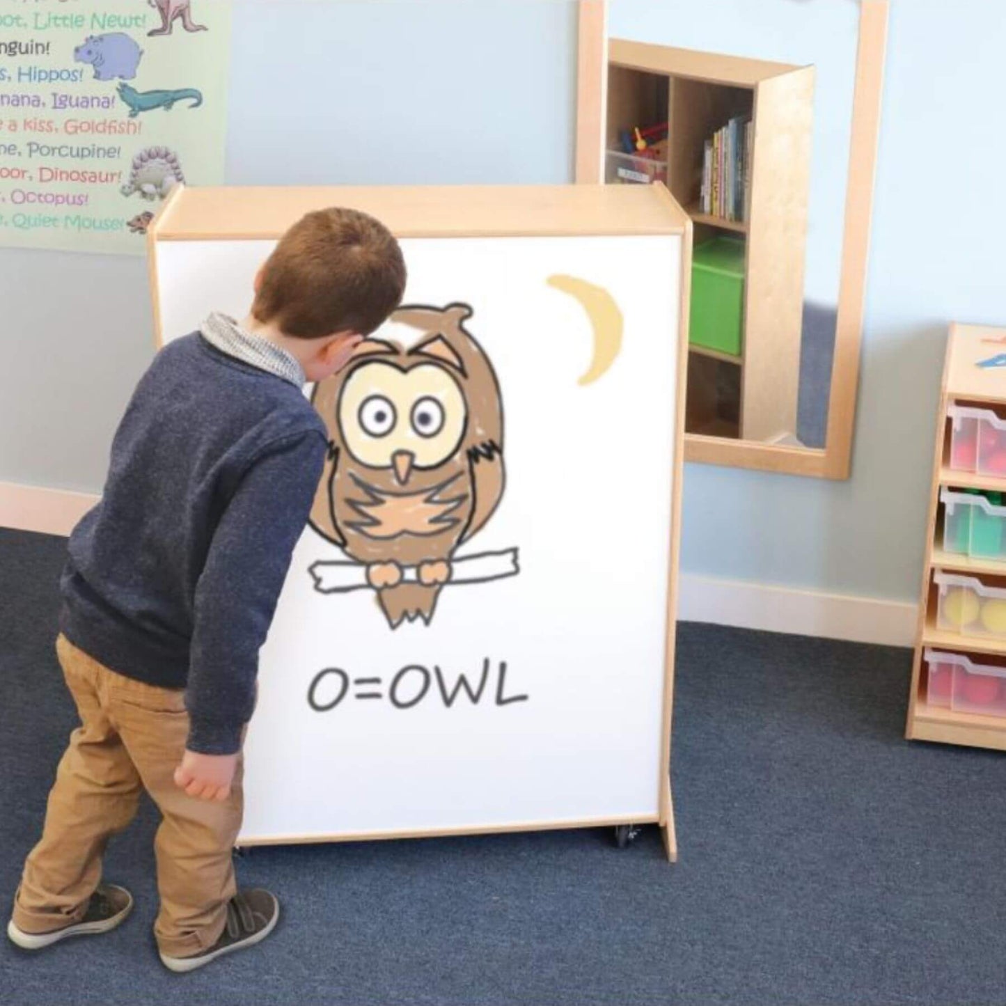 Boy Drawing on Whitney Brothers Nine Cubby Storage And Teaching Center