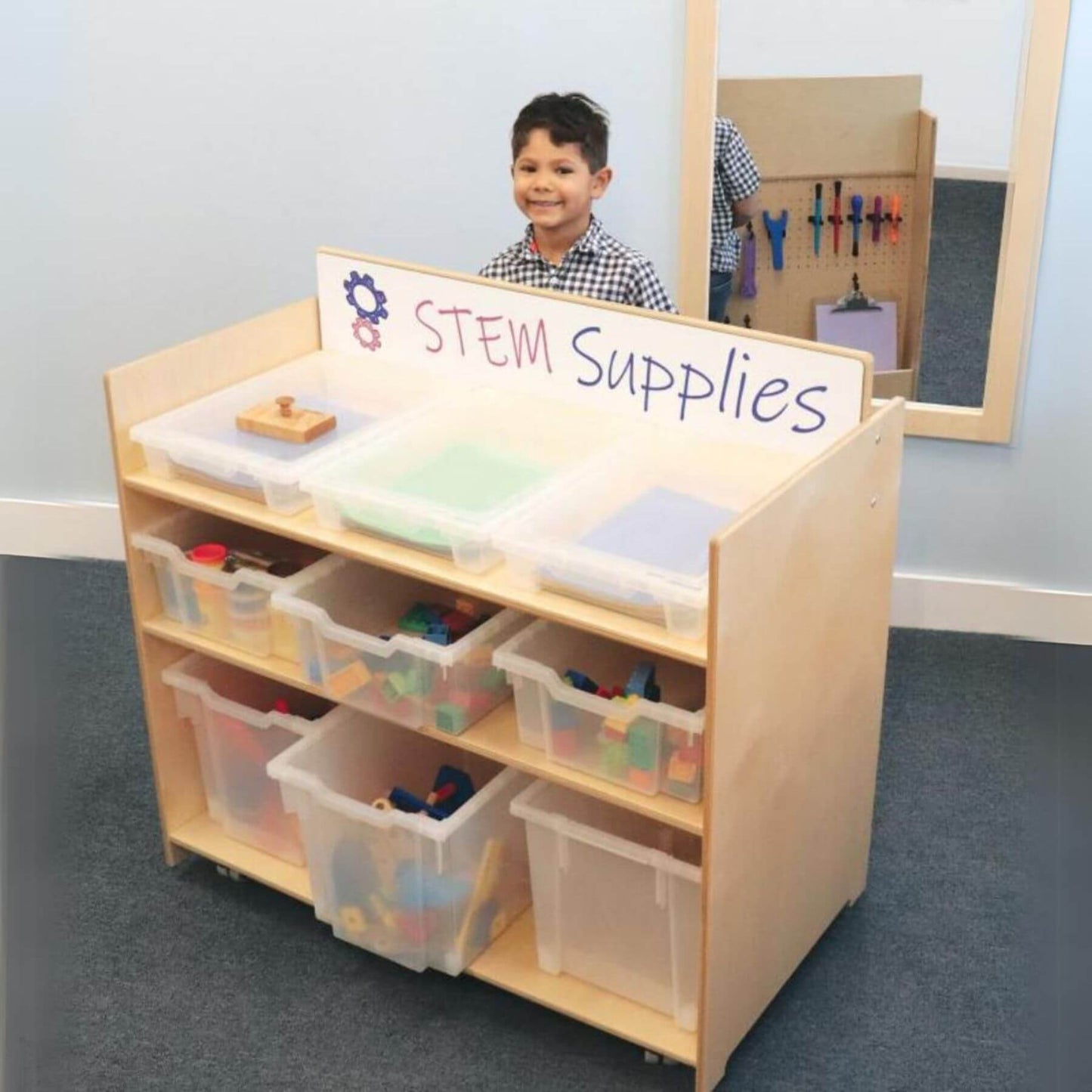 Boy Standing Behind Whitney Brothers Preschool STEM Cart