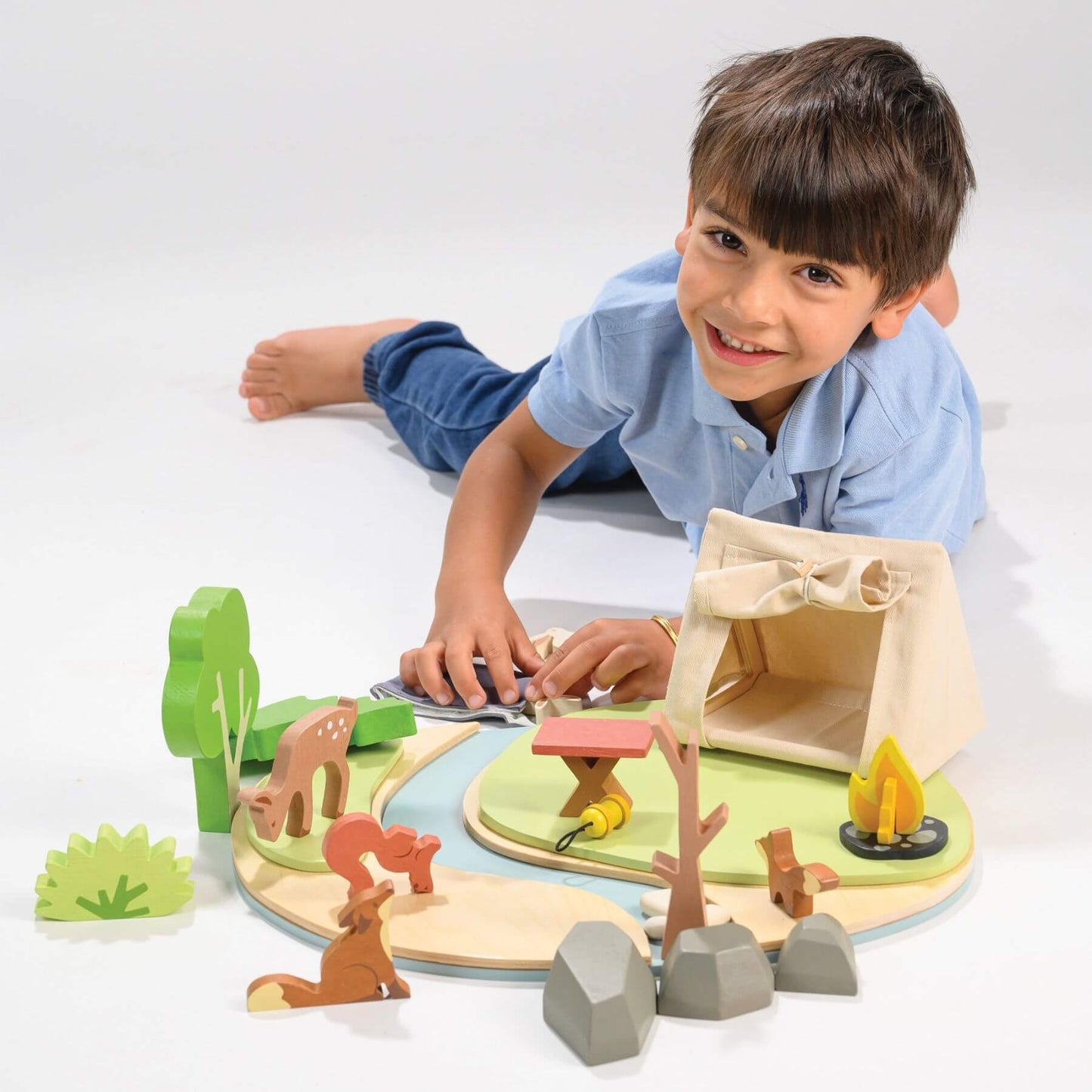 Child playing with Tender Leaf Wildlife Camping Playset