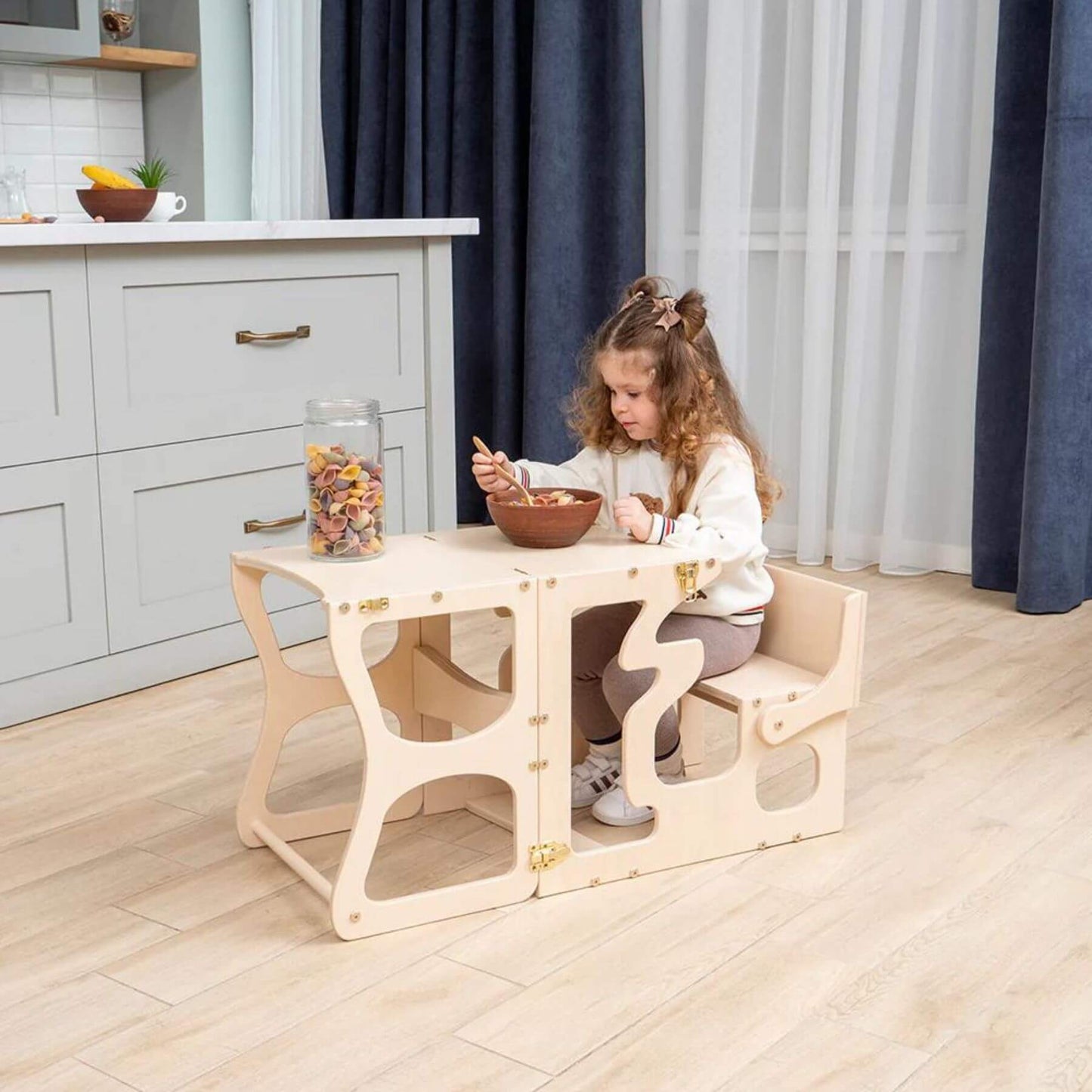 Girl Eating at Wood and Hearts Convertible Kitchen Tower