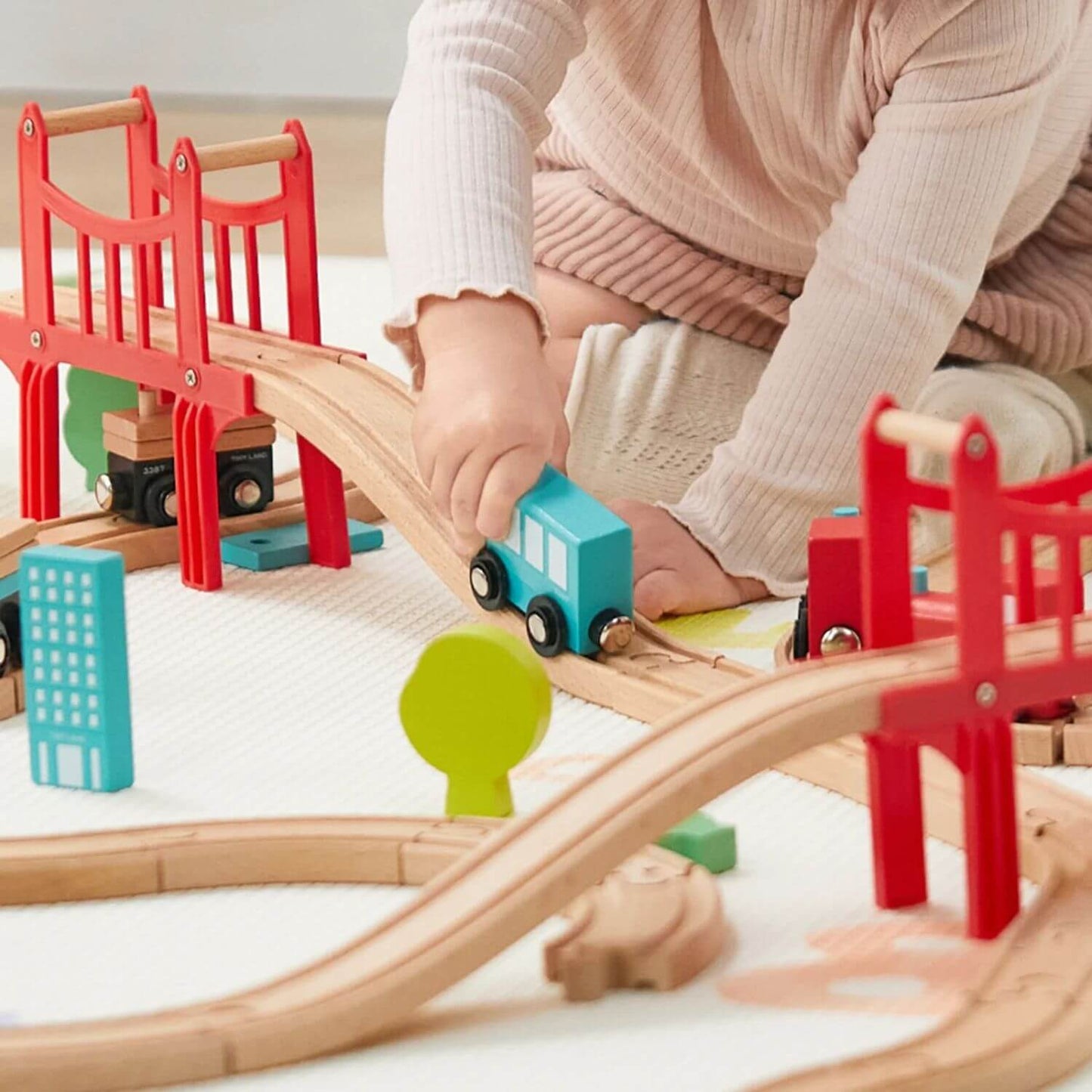 Kid Playing Tiny Land® Wooden Train Set for Children 39 Pcs