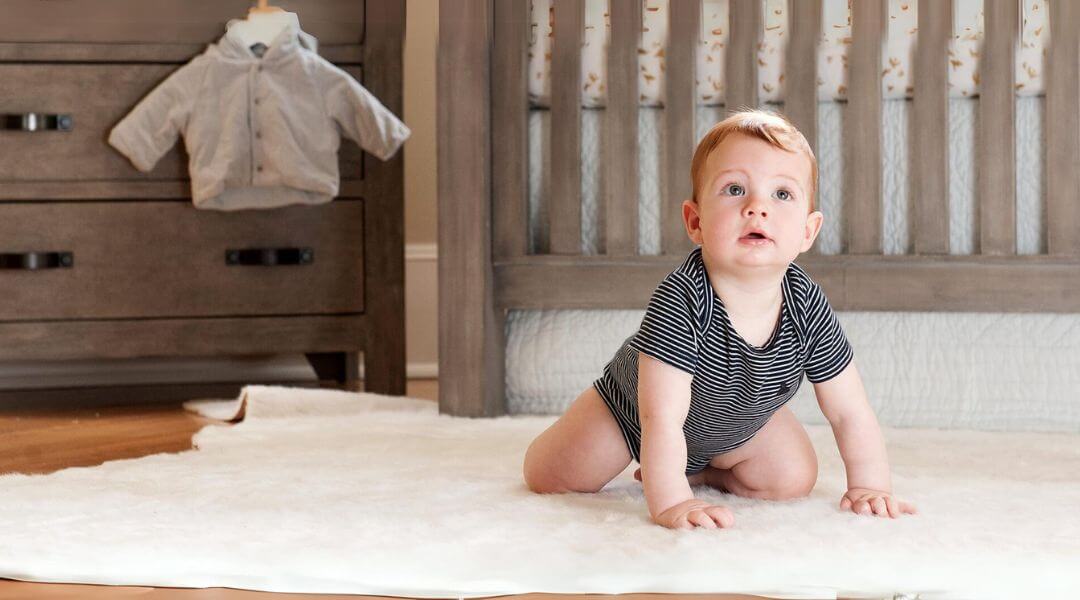 Baby crawling on carpet