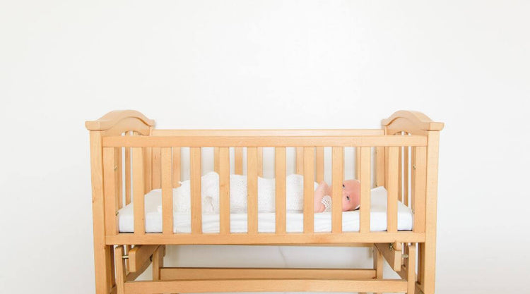 baby sleeping in a crib