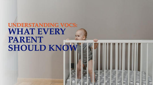 baby standing in a white crib