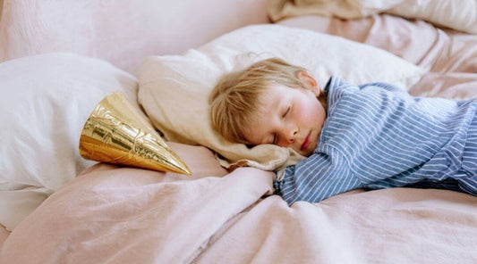 boy sleeping on bed