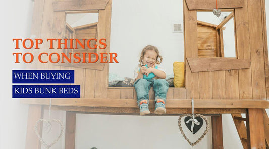 kid sitting on a bunk bed