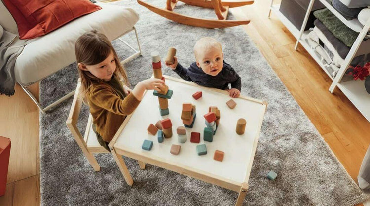 kids playing korko building blocks at table