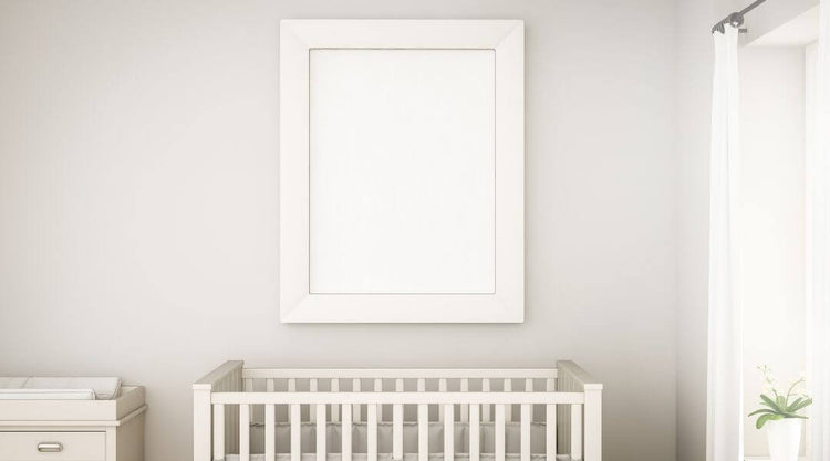 Nursery Room with white furniture and decor