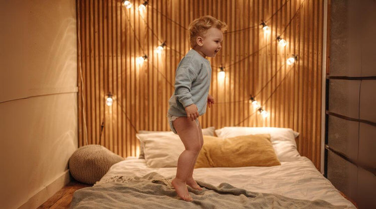 Boy Jumping on Bed