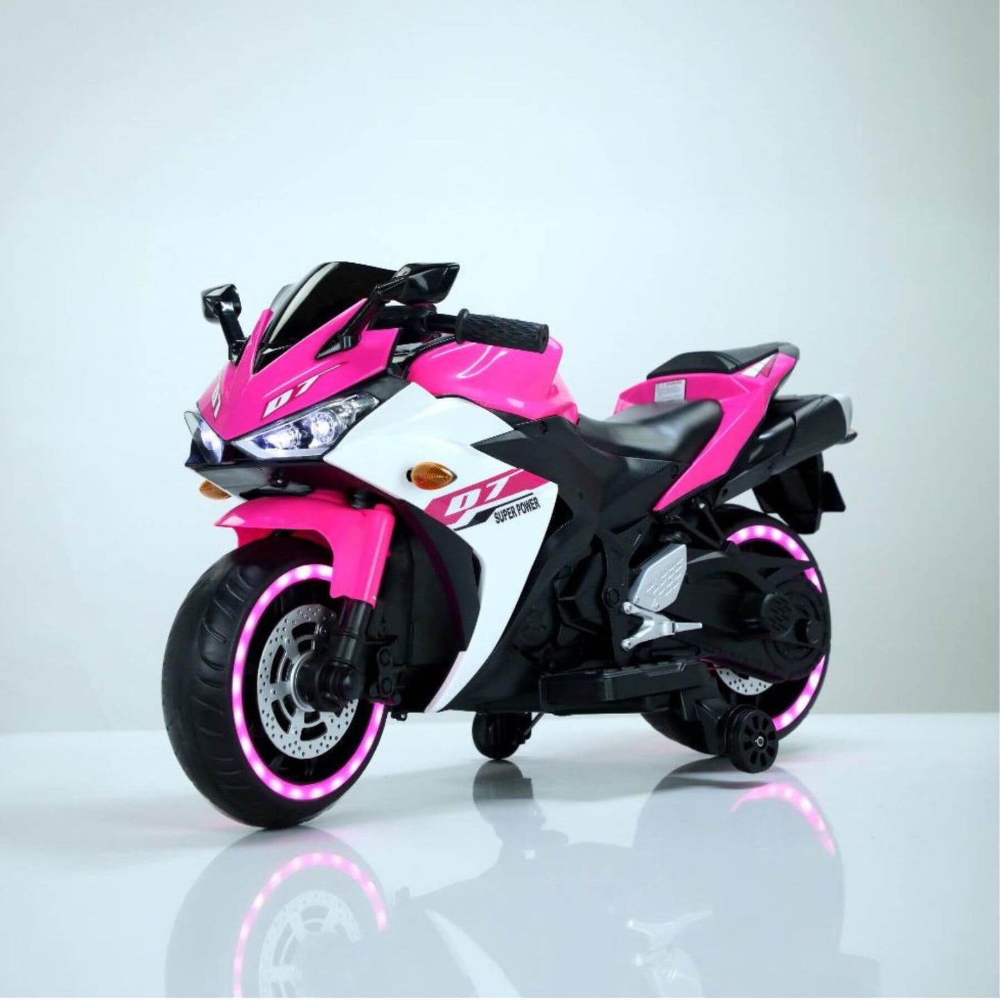 Tamco 12 V Kids Toys Electric Motorcycle with Training Wheels - Pink on a white background