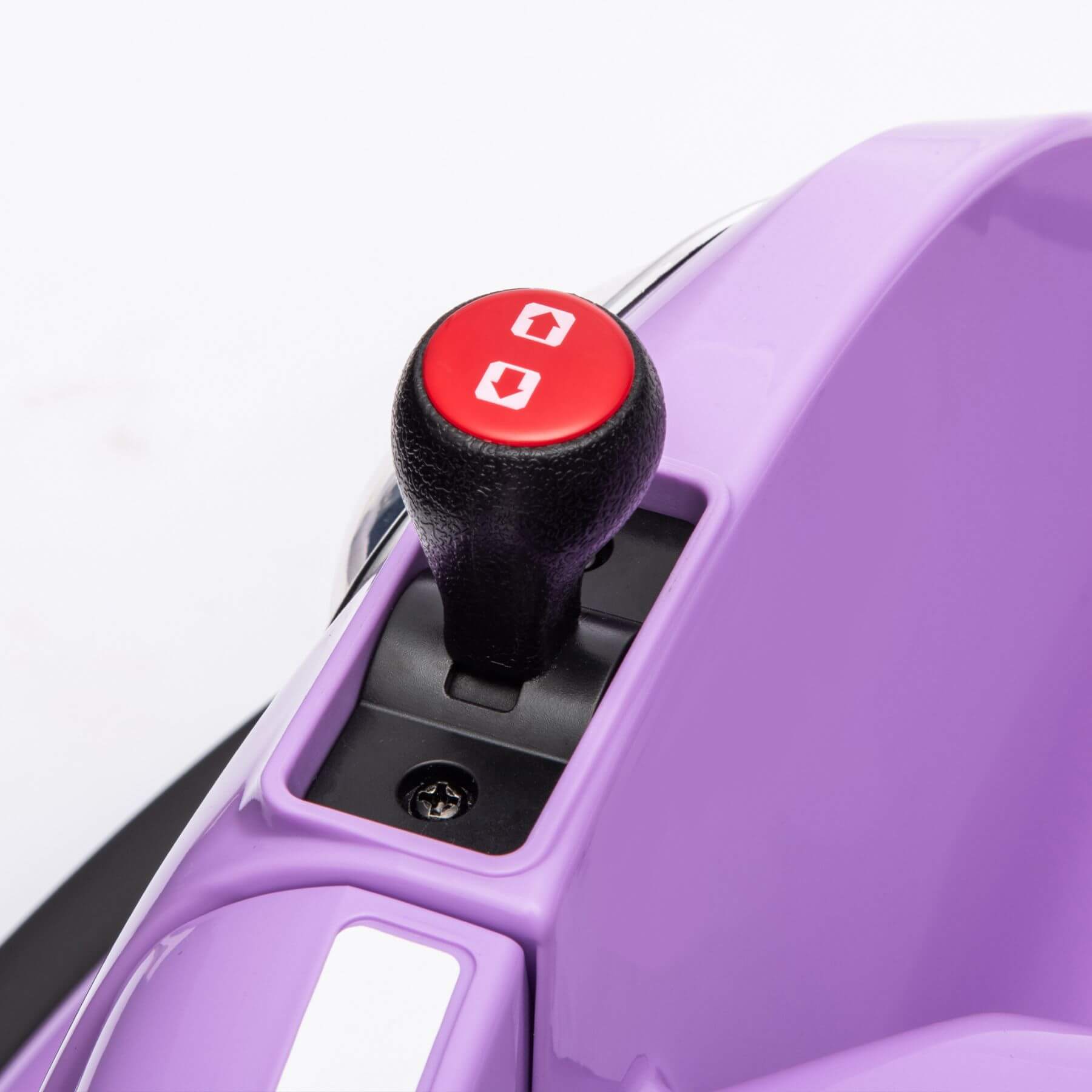 A red and black control knob on a toy car